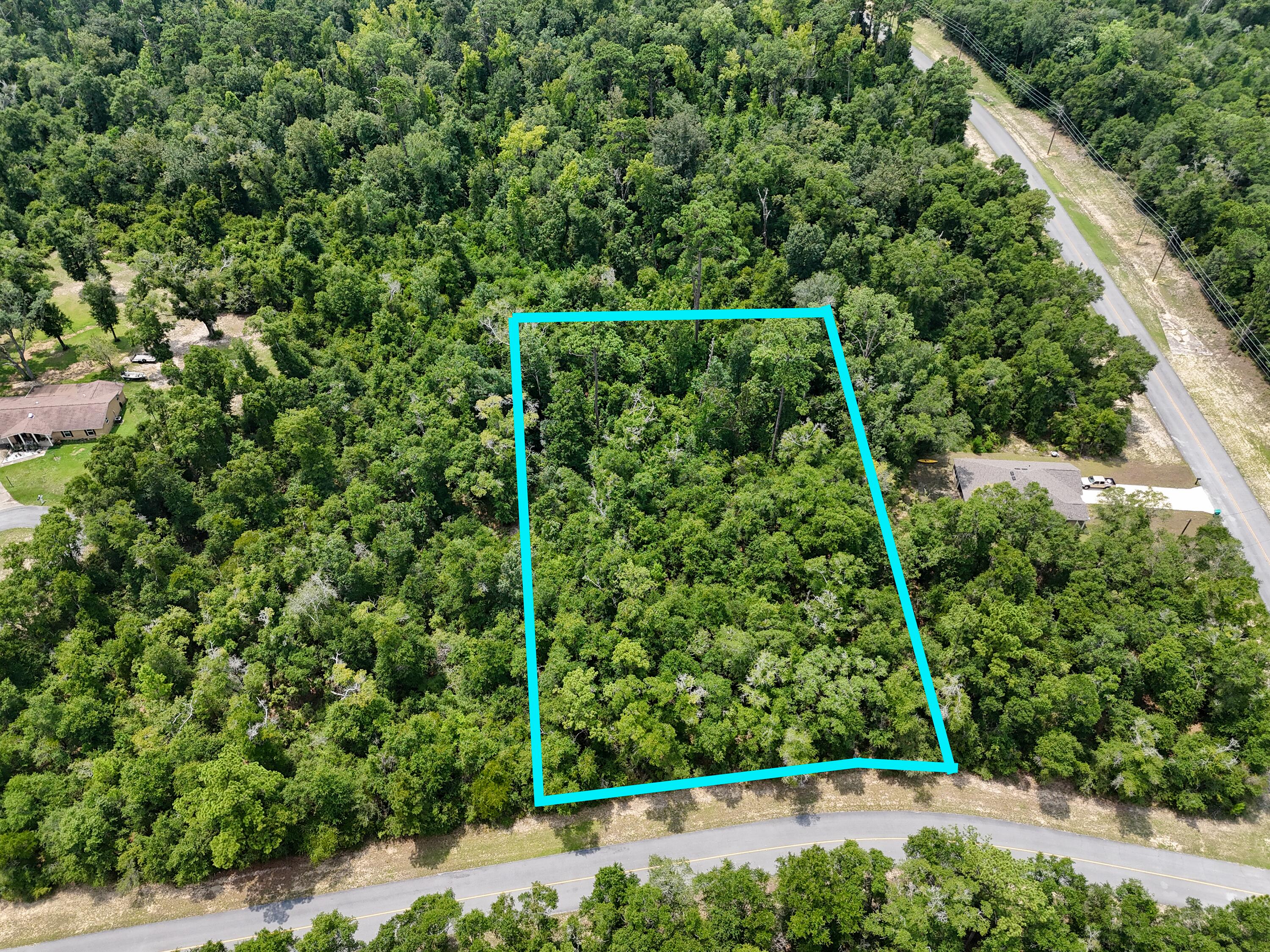 Rare opportunity to own 1.57 acres in the growing Sunny Hills community! Offered together, Lot 4 is approximately .88 acre and Lot 5 is approximately .69 acre, giving you significantly more space and flexibility than the typical homesite in the area. Located near the Sunny Hills Golf Course, these lots offer a peaceful setting with plenty of room to bring your vision to life. With each lot having its own separate tax ID, the possibilities are exciting. Combine the two lots and create a spacious private estate with room to spread out, or explore the option of building two homes--live on one lot and build next door for parents, extended family, or future use. Buyers should verify building requirements and lot combination or development options with the appropriate authorities. Enjoy the slower pace and natural surroundings of Sunny Hills while still being approximately 30 minutes from the white-sand beaches of Panama City Beach. Whether you're dreaming of a full-time residence, retirement retreat, or a property with room for family nearby, finding this much land so close to the golf course is a rare opportunity. Bring your builder, your plans, and your imagination--1.57 acres gives you room to create something special!