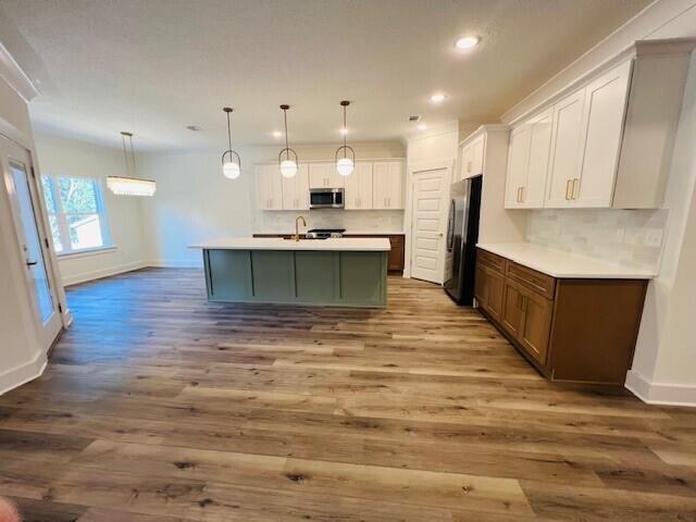 Unbeatable Builder Incentives! Get 2% towards closing costs, PLUS doc stamps, title, the final survey, 6' privacy fence, window blinds, and a refrigerator are covered with an acceptable offer. 

Tucked away on an exclusive cul-de-sac street with only 9 homes, this custom, spacious 5-bedroom, 3-bathroom sanctuary offers fantastic privacy. Designed with elegance and functionality in mind, the home features soaring 10' ceilings--reaching 12' in the primary suite and the open-concept great room. The gourmet kitchen features premium GE stainless steel appliances, a beautifully tiled backsplash, and custom soft-close cabinets with quartz or granite countertops, all blending seamlessly into the dining and living spaces overlooking the backyard.

Retreat to the luxurious primary suite, complete with a beautifully tiled master shower and separate soaking tub. Exceptional finishes elevate every corner, including quartz or granite countertops in all bathrooms, 7' crown molding, a tankless water heater, and durable LVP and/or tile flooring throughout (ZERO carpet!).

Outside, enjoy professional landscaping with a well-fed sprinkler system, gutters, and a 3-car garage with attic storage. For your peace of mind, this home includes a 1-year builder warranty, a 10-year structural warranty, and a 1-year termite bond. Located in the highly desirable Hammock Bay community, you'll enjoy quiet cul-de-sac living while gaining access to premier, resort-style amenities.
Estimated Completion 9/30