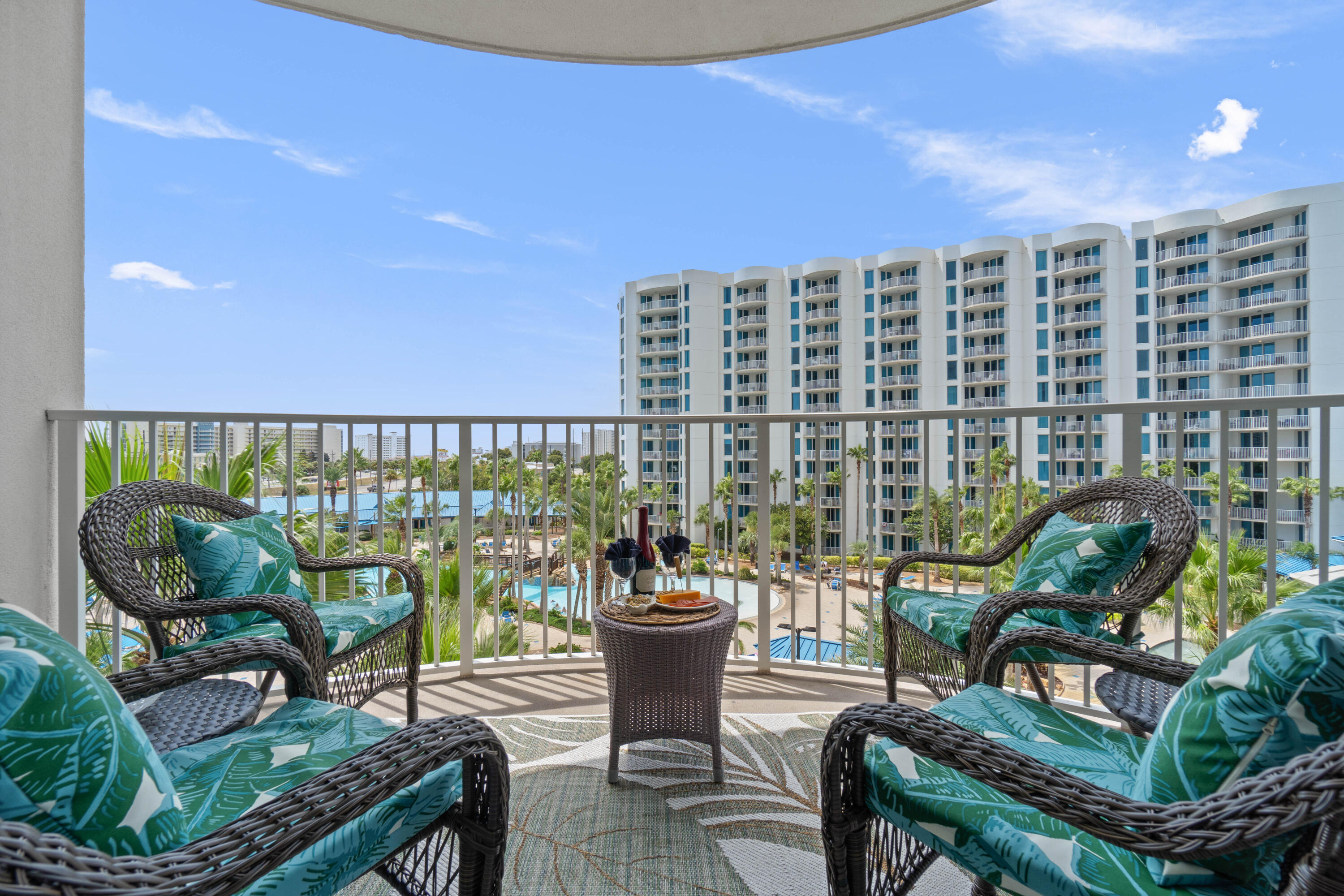 Don't Miss this Guest Favorite, it is a Rental Gem, Improved Price for a Better ROI: With an impressive rental history, $49,269  in booking in 2025. And already looking to exceed that at $48,252 as of 9/3/26.  This 5 star resort offers a Unique Lagoon Pool and tropical resort balcony view, with beach vibes. Enjoy Five-Star Amenities at The Palms of Destin Resort! This beautifully upgraded 2-bedroom, 2-bathroom Jr Suite condo is perfectly situated in the heart of Destin. A quick walk to the beach for sunsets. Combining charming beach decor with tons of upgrades. This home has been well loved and cared for. Step inside to find a fresh white palate with coastal accents, new furnishings and thoughtful decor.  As you flow through the condo you will find it has all the comforts of home with a fully stocked kitchen, with upgraded kitchen  and granite counter top. Unit 1509 comes fully Furnished, with all that you and your guests will come to love and adore to make the most of your beach retreat. 2 New sofas just delivered. 
Stepping out from the living room sliding glass doors, you will enjoy your own private balcony to sit back and take it all in. The unique view will capture your attention, with the lively pool deck, overlooking the Resort's Lagoon pool and tropical landscapes. Entering back inside: from two locations, you can access the Primary Bedroom with on suite bathroom and garden tub, black out curtains to sleep in and experience your vacation escape. The Jr bunk room has custom twin over full bed, It's own bathroom with walk in shower, and Full Laundry. If youre looking for the perfect Short Yerm Rental Set up: this property comes fully stocked, and furnished,  with a book of business to hit the ground running! This is the perfect Choice.