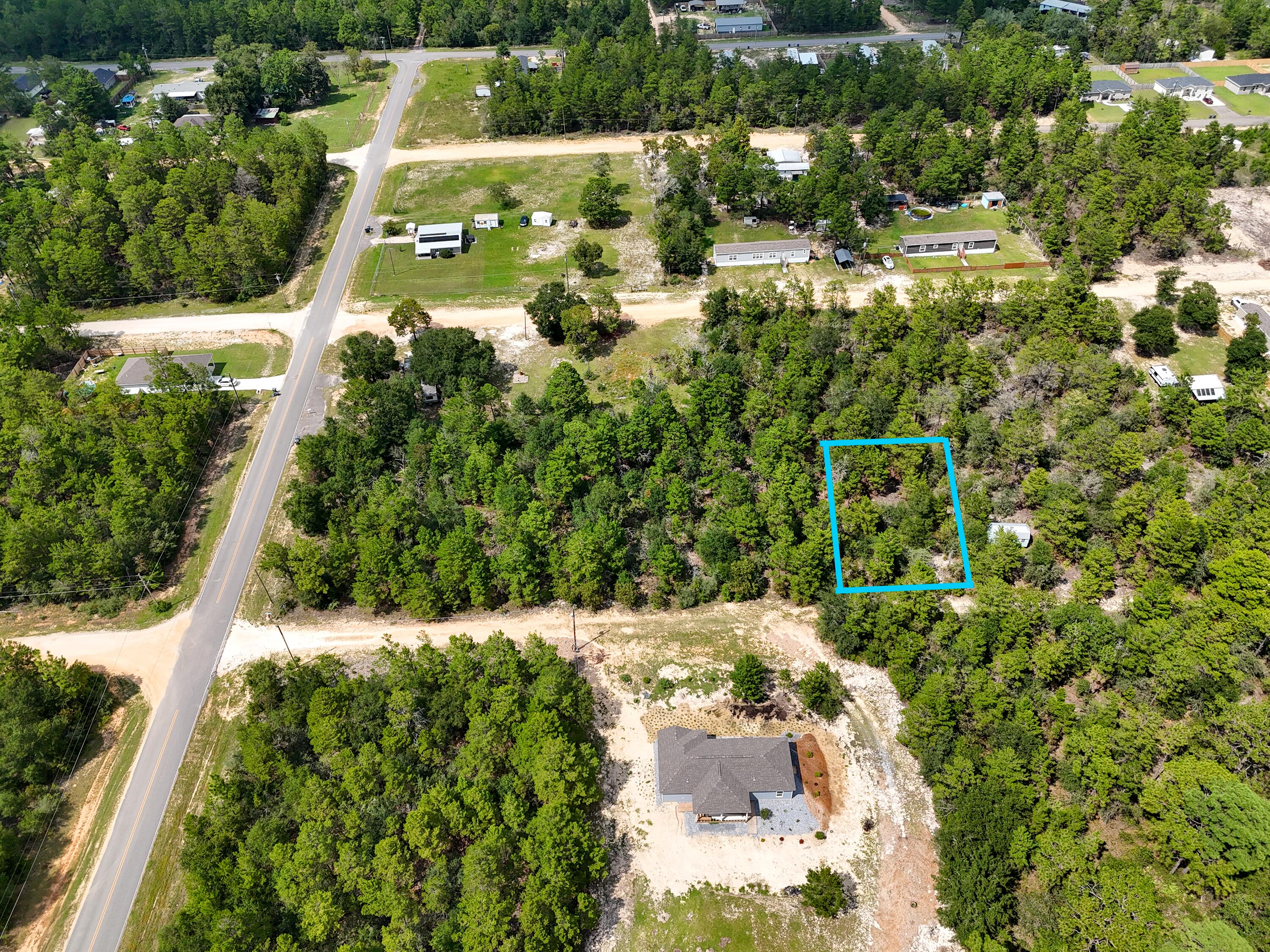 If you have been sitting back watching the market for a deal here it is! Almost 1/4 of an acre for ONLY $14,900k with an additional lot available. Located just off HWY 90 allows for a easy commute to town and to jobs. Loys at this price do not come along often. Mossy Head water available and Chleco Power just across the street makes getting utilities easy!  Property recently has a septic, but location is unknown on which lot it is on and seller has no knowledge of use capability. Grab this deal today!