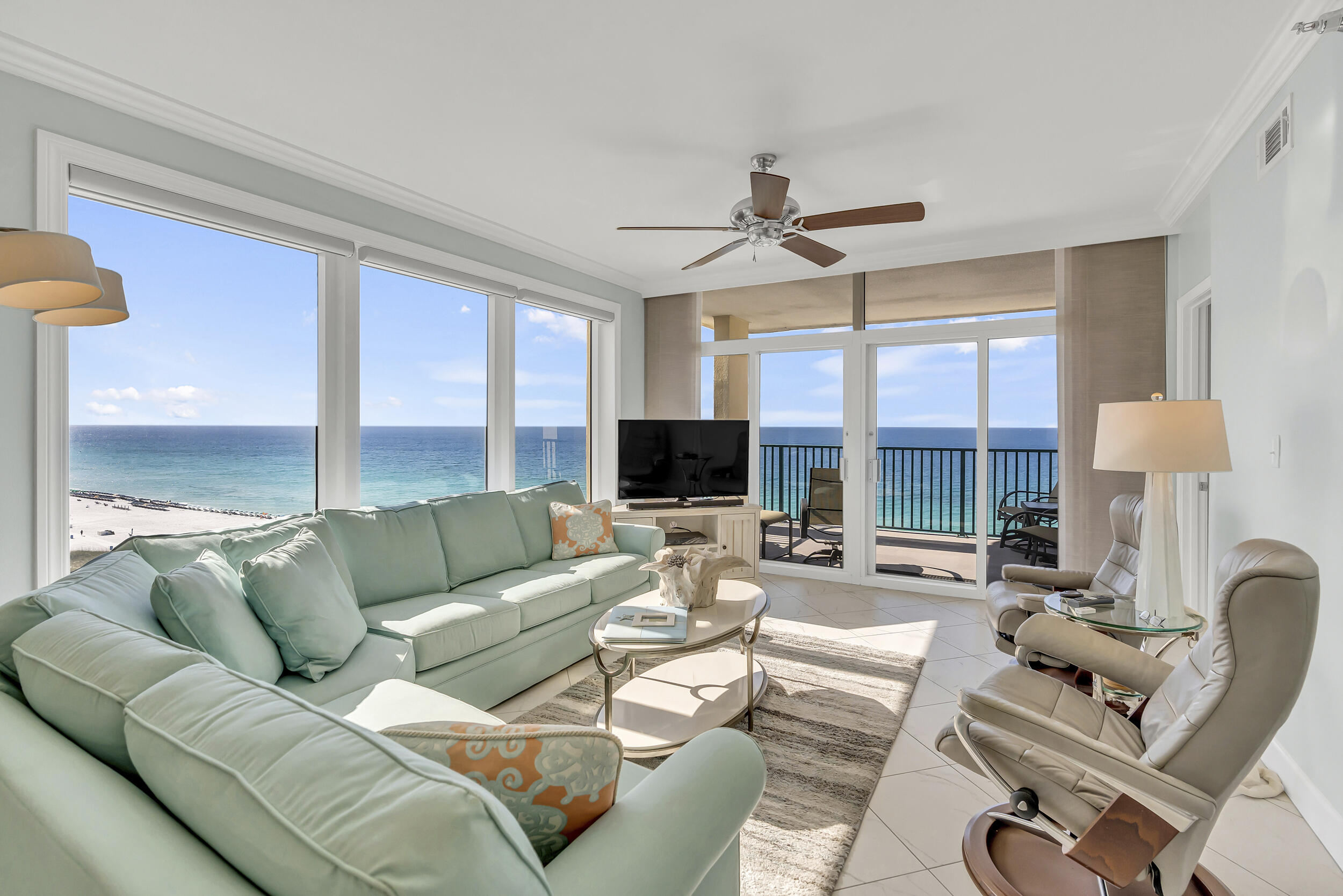 Pristine condition with stunning views of the Gulf, beach, and coastline - DON'T LET THIS ONE SLIP AWAY! 3 bed/3 bath corner unit with INCREDIBLE Gulf and beach views for miles. Completely remodeled as a private second home and never rented since, this unit remains in pristine condition. Sugar Beach Interiors completed extensive custom upgrades and it shows in every detail. The list of all the renovations made are so long that there is not enough room to list here, but some features include custom cabinetry, quartz countertops throughout, KitchenAid appliances, Silgranite kitchen sink, instant hot faucet, upgraded housewares and china, premium bathroom tile, ShowerGuard glass, custom primary closet cabinetry, plantation shutters, custom blinds, pocket doors, and an automatic shade in the laundry area. Words cannot describe it - you must see in person! Sold FULLY FURNISHED - TURNKEY! Jade East is a gated Gulf-front community offering private beach access, pool, fitness center, barbecue area, tennis courts, 1 deeded parking space close to entrance, and beach storage. Centrally located near dining, shopping, and entertainment. Ideal as a second home or investment property. Easy to show -- this one must be seen to be fully appreciated!