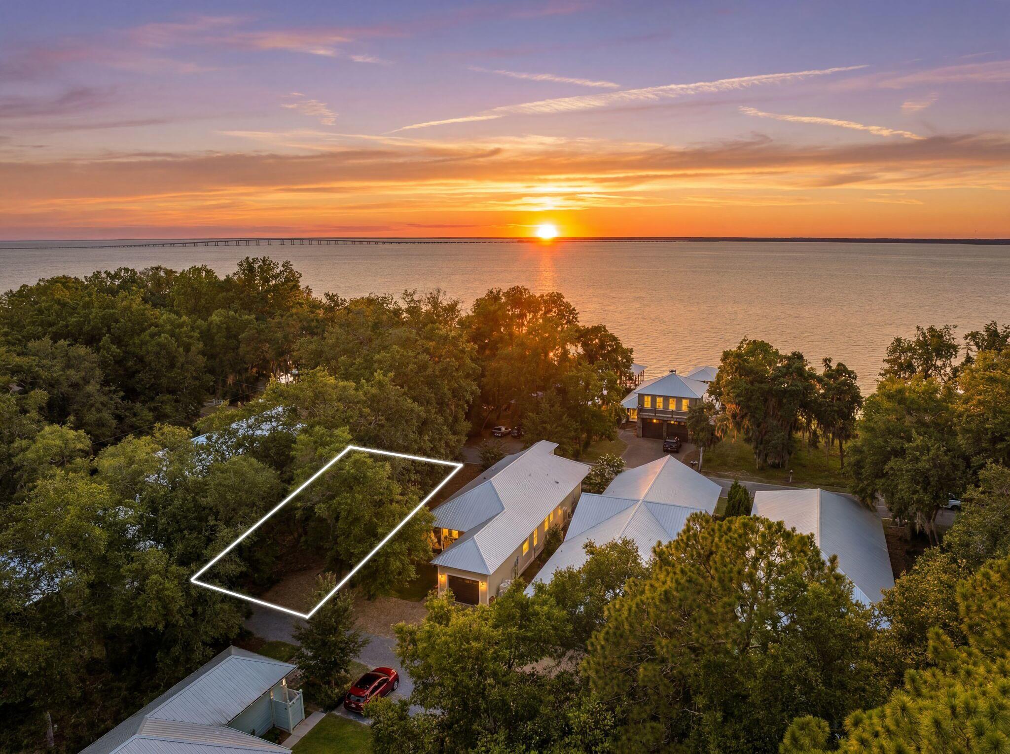 Tucked away in Point Washington, just steps from the Choctawhatchee Bay, this 0.15 acre homesite offers the chance to build in one of South Walton's most distinctive coastal settings. Set along a brick-paved cul-de-sac street beneath towering live oaks draped in Spanish moss, the neighborhood preserves the quiet beauty of Old Florida. Enjoy easy access to the bay for paddleboarding and kayaking, breathtaking sunsets from the neighborhood dock, and regular sightings of dolphins, pelicans, and bald eagles. While the setting feels peaceful and tucked away, the sugar-white beaches of 30A, Grayton Beach State Park, local dining, and shopping are all less than 10 minutes away. Whether you're planning a full-time residence or a weekend getaway, this homesite offers a setting where mature trees, bay breezes, and a slower pace of life still define the landscape. Contact us for more information.

All information is deemed reliable and provided for informational purposes; buyers are encouraged to independently verify all details.