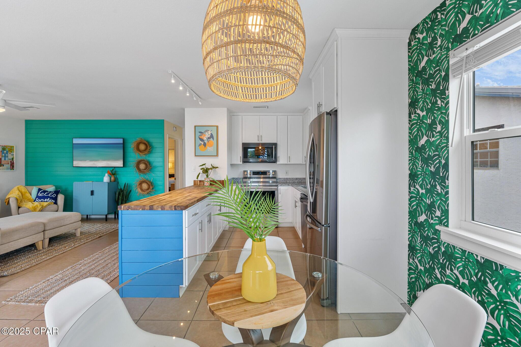 Ideally positioned just 600 feet from dedicated beach access #87, this updated duplex bungalow blends modern coastal design with the charm of classic Old Florida. Situated on a spacious corner lot, the property offers both turn-key functionality and long-term potential, making it a compelling opportunity for investors or multi-generational living.

Each level is thoughtfully designed with open-concept living and dining areas, allowing the interiors to feel bright, spacious, and inviting. The ground-floor unit features one bedroom with a king-size bed, a full bath, and a bonus trundle room for additional guests. Upstairs, the two-bedroom layout offers ample space and panoramic Gulf views from the expansive deck--perfect for dining al fresco or basking in the sea breeze.