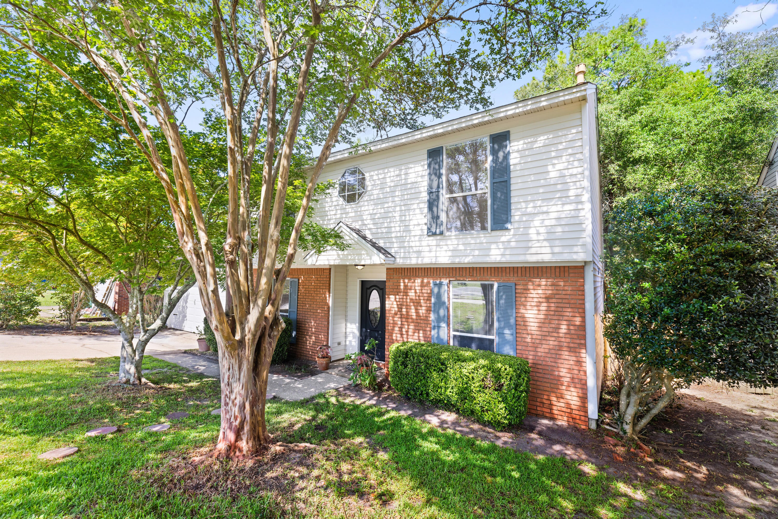 This charming 3-bedroom, 2.5-bath is nestled in a peaceful Niceville setting offering 1,661 square feet of comfortable living space. Mature crepe myrtles welcome you to this well cared for home and combines updates with natural beauty.
Fresh interior paint creates a bright, inviting atmosphere throughout the home, while a new water heater, 2025 HVAC, and recently installed fence provide added value and peace of mind. The functional floor plan offers comfortable living spaces designed to fit a variety of lifestyles.
One of the home's standout features is the beautiful rear deck, providing the perfect place to relax while overlooking the private backyard and mature trees beyond.
The tranquil outdoor setting creates a sense of seclusion while remaining conveniently located to schools, shopping, dining, military bases, and the white-sand beaches of the Emerald Coast. Only 4 miles to Eglin Air Force Base, and less than 2 miles to the beautiful Turkey Creek. 2 miles into the shopping, dining, and schools of Niceville make this home an ideal location for anyone.