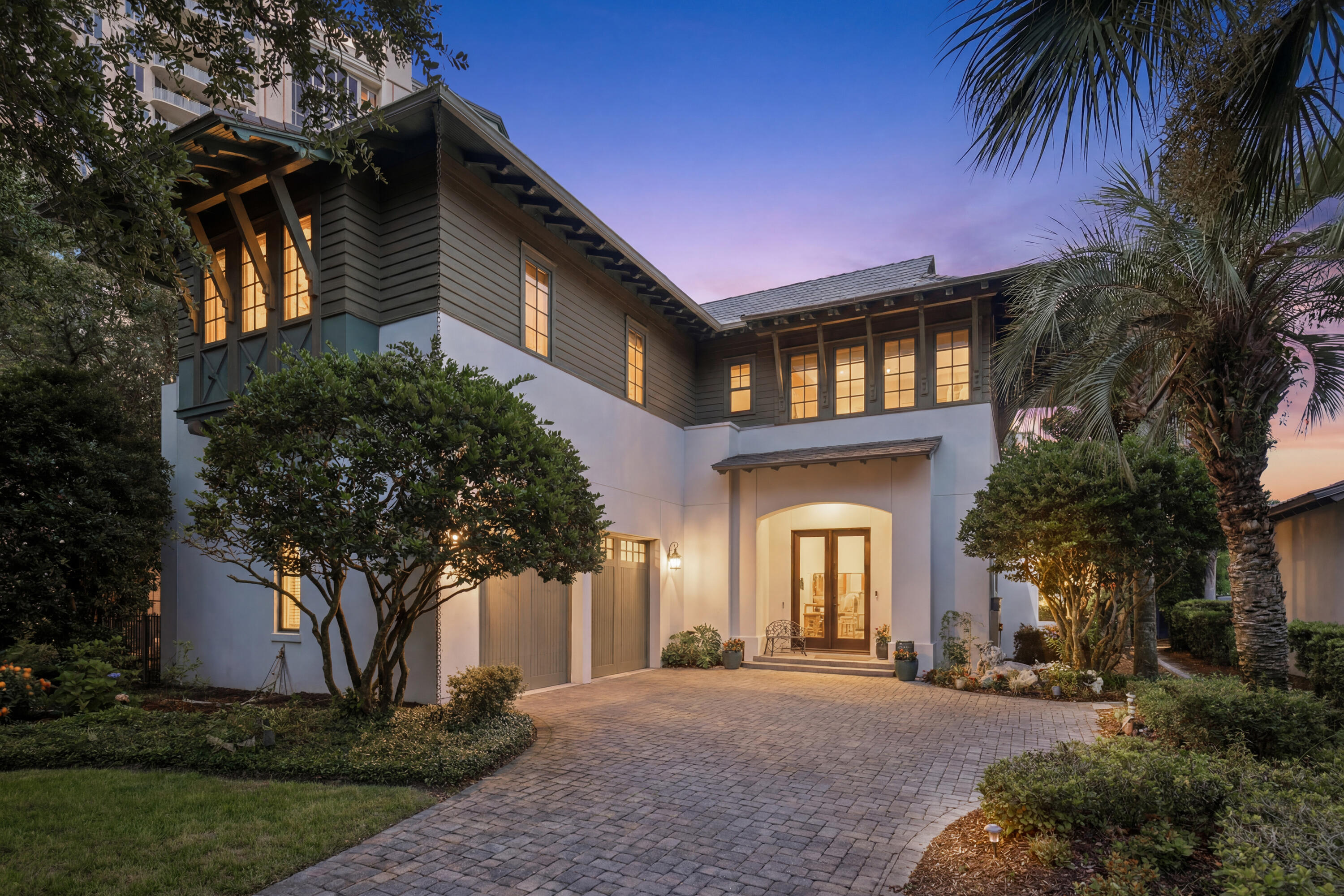 Experience refined coastal living within the prestigious, gated waterfront enclave of Island Estates, one of the area's most coveted beachside communities. Designed for an exceptional lifestyle, residents enjoy exclusive access to the newly renovated Beach Club, private golf cart parking in the community's new cart garage, and the convenience of a golf cart for effortless access to the resort and its world-class amenities. Perfectly positioned to capture tranquil lake views, this exceptional waterfront residence showcases timeless West Indies-inspired architecture, impeccable craftsmanship, and sophisticated elegance throughout. Lush landscaping creates a captivating setting, while the exquisitely appointed interior welcomes you in with rich American cherry hardwood flooring and a dramatic two-story foyer highlighted by a graceful curved staircase. Designed for both grand entertaining and everyday comfort, the expansive living spaces are bathed in natural light and seamlessly connect to the private pool pavilion through multiple French doors, creating an effortless indoor-outdoor lifestyle. The thoughtfully redesigned kitchen is crafted for both style and function, featuring custom cabinetry, striking quartz countertops, designer lighting and fixtures, an elegant backsplash, and a custom pantry. A premium suite of professional-grade appliances includes a Wolf double-oven range, Wolf cooktop, Sub-Zero refrigerator, and wine chiller. The luxurious first-floor primary retreat offers a serene sanctuary, complete with a beautifully renovated ensuite bath and large walk-in closet. Upstairs, two generously proportioned guest suites, each with a private bath, provide exceptional comfort and privacy. An oversized loft-style living area with a wet bar and abundant storage creates the perfect setting for relaxation or entertaining. This remarkable residence has also been thoughtfully updated with a new roof, HVAC, Water Heater, gutters, and complete interior and exterior painted, offering peace of mind while complementing its enduring quality and timeless appeal.
A rare opportunity to own an extraordinary waterfront home where architectural beauty, refined finishes, and an unrivaled coastal lifestyle come together in one of the area's most desirable gated communities.