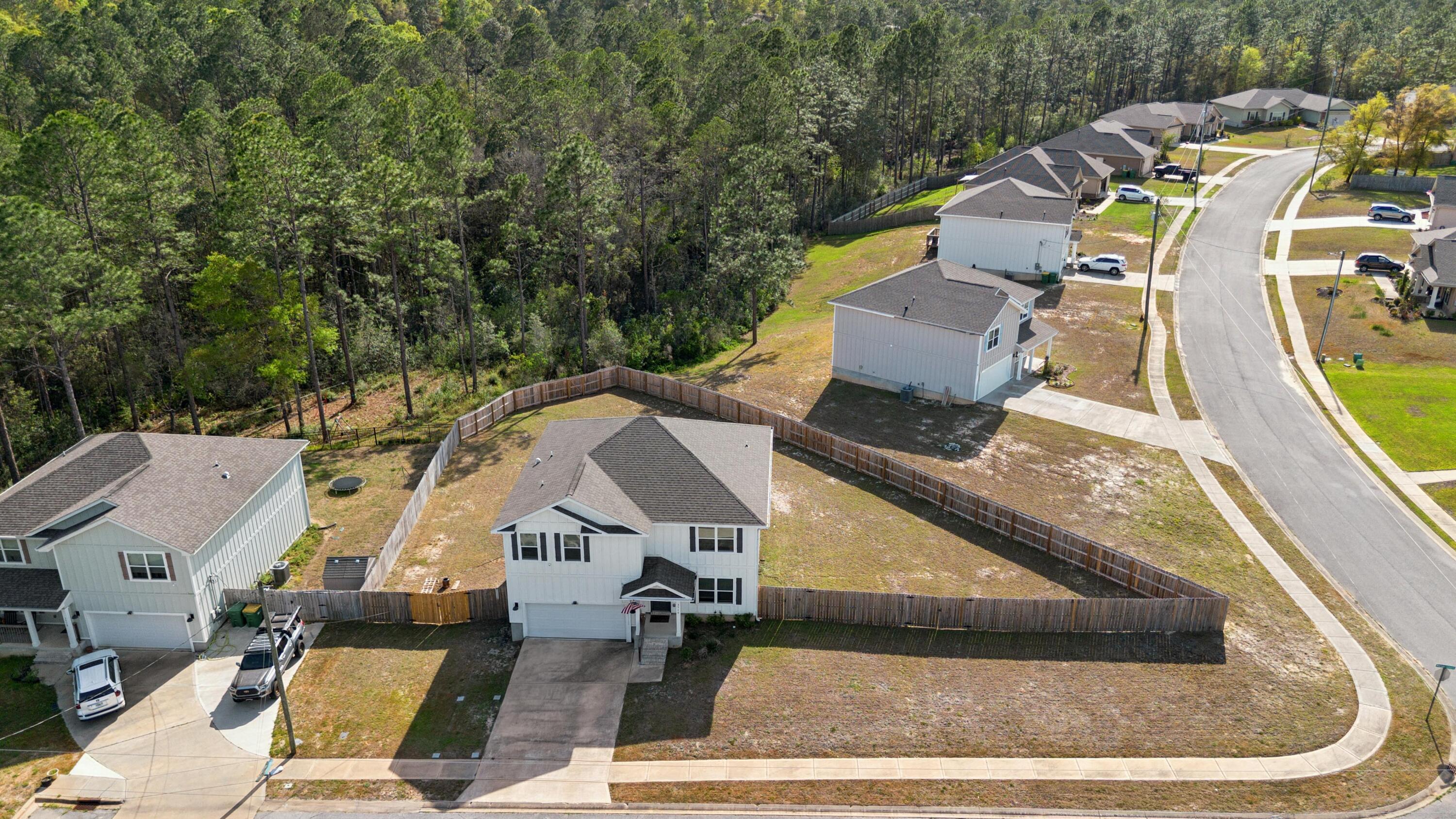 Located in the established Timberland Ridge community, you gain the peace of mind that comes with proven school proximity and neighborhood stability. A massive investment is already completed with a fully fenced .39-acre cul-de-sac lot. The home features recently replaced upstairs windows for enhanced climate control and fresh interior paint in a crisp, modern palette that makes the space feel brand new. The open-concept main floor offers durable EVP flooring and a chef's kitchen anchored by a massive island and stainless steel appliances. With five generous bedrooms and three full bathrooms, there is ample space for the whole family plus a dedicated home office. The convenient downstairs guest suite provides critical flexibility for visiting family or temporary duty transitions. As one of the largest homesites in the area, this property offers a scenic retreat at the end of a quiet street with zero through-traffic.