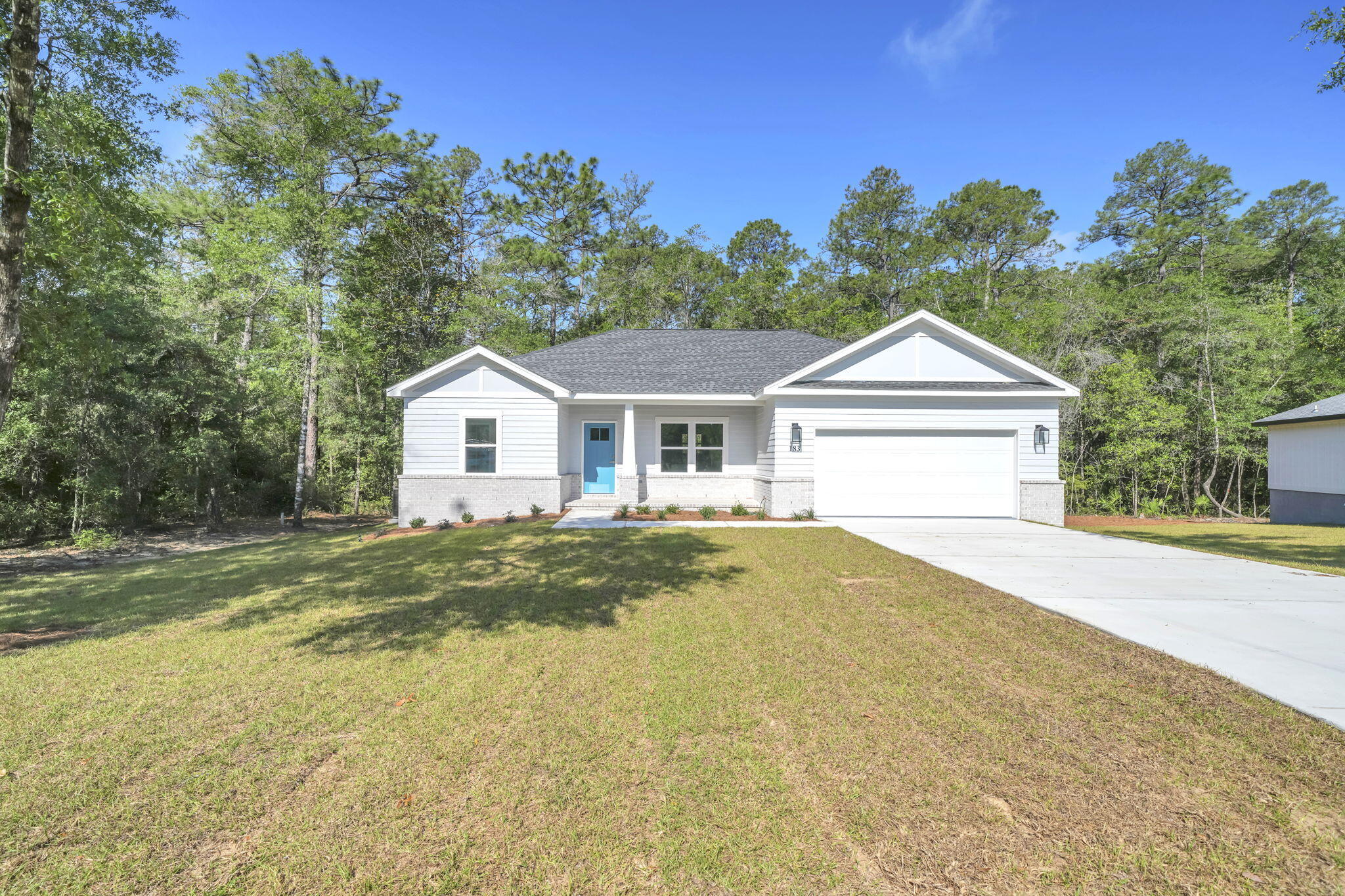 **Under contract with 72 kickout clause**BRAND NEW CONSTRUCTION! IDEAL LOCATION!  MOVE IN READY!  This new home is perfectly situated in the community of Hunter's Ridge located directly behind Walton High School with close proximity to city parks and Downtown Defuniak Springs.  Hunter's Ridge boasts; underground utilities, countless trees, and public water/sewer.  Enjoy the comfort of the split bedroom floor plan. Interior features include; LVP (luxury vinyl plank) flooring in the main living areas, tiled bathroom floors, stainless appliances, solid surface countertops, high-grade mill work, custom shelving in closets/pantry, and a plethora of recessed, can lighting/designer light fixtures.  Exterior features; architectural brick and fiber cement siding, wooden tongue and groove stained entry ceiling at front porch, two-car garage, and 3 dimensional roof shingles.  Make 183 Hunters Ridge Drive your brand new Florida address!!