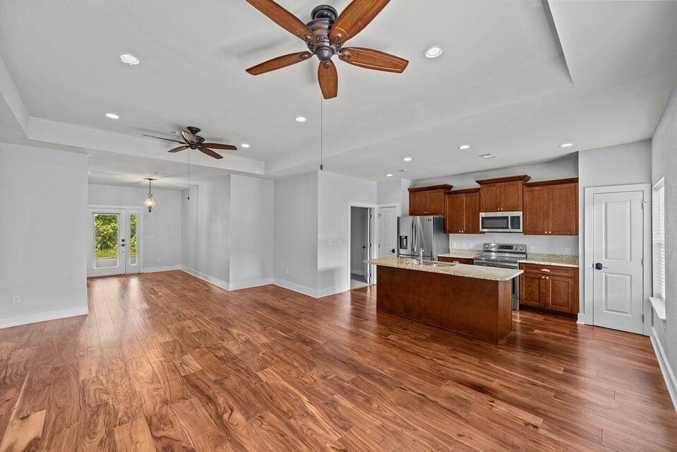 Welcome to this charming 3-bedroom, 2-bathroom Southern-style coastal cottage located in the gated community of Hidden Grove in Santa Rosa Beach. Boasting an open-concept single-level floor plan, this home features high tray ceilings, beautiful hardwood flooring, and hurricane-rated impact windows and doors throughout. The light-filled kitchen with granite countertops, custom cabinetry, and stainless-steel appliances, while the primary suite offers a spacious retreat complete with a large walk-in closet and a glass-enclosed shower. Outside, enjoy low-maintenance coastal living with a inviting front porch, a private Trex deck, a fully fenced backyard, metal roof and a one-car garage. Situated in Flood Zone X (no flood insurance required). Enjoy the neighborhood community pool, all while being just minutes from the bay, public boat launches, Grand Boulevard shopping and dining, and the white sand beaches of Scenic Highway 30A.