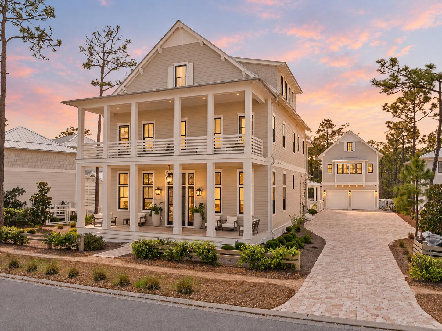 In WaterColor, the most compelling homes are not simply designed for a week at the beach. They are created for the rhythm of everyday life on 30A. Slow mornings, time outdoors, family gatherings, and the ability to comfortably host the people you love.

At 565 East Royal Fern, that sense of permanence is immediately clear. Built by Borges Brooks Builders and designed by TS Adams, the residence feels less like a traditional vacation property and more like a thoughtfully composed coastal compound. Architecture, craftsmanship, and livability were considered in equal measure, creating a home that is equally suited for quiet daily routines and larger gatherings with family and friends.

The interiors are warm, relaxed, and designed to be lived in. Oak floors by Seashore Flooring extend throughout the home, complementing a natural palette of whites and wood tones. Expansive openings allow sunlight to move easily through the living spaces, while subtle architectural details give each room its own character. Several furnishings were custom designed by the homeowner and handcrafted by Amish craftsmen, adding a personal layer that makes the home feel collected rather than staged.

At the center of the main living space, the kitchen balances beautiful design with the functionality needed for everyday use. A waterfall island offers generous room for meals, homework, conversation, and entertaining, while dome pendants create a clean architectural focal point. A 60-inch Wolf range and Liebherr refrigerator complete the appliance package. The carriage house features quartz countertops and coordinated finishes, allowing it to function comfortably as a private space for extended family, guests, or live-in support.

With eight bedrooms, including the private carriage house, the home provides the flexibility that full-time living often requires. The primary suite is positioned as a true retreat, featuring a spa-style bathroom with a soaking tub, electric fireplace, dual closets, and direct access to a private patio. Guest accommodations are thoughtfully distributed throughout the property, offering privacy without feeling disconnected from the rest of the home.

Practical construction decisions further set the residence apart. The elevated, foam-insulated slab was designed to enhance stability and help prevent floor movement over time. Real stone in the downstairs guest bathroom reflects the emphasis on authentic materials, while EPAY decking throughout the outdoor living areas was selected for its durability in the coastal environment.

Outside, the resort-style pool and covered pavilion become a natural extension of the home. The spaces are designed for more than entertaining, offering room for morning coffee, afternoons by the pool, outdoor dinners, and the everyday moments that make living on 30A so special.

565 East Royal Fern offers the rare opportunity to experience WaterColor not simply as a destination, but as home. It is a residence defined by thoughtful design, lasting craftsmanship, and a more personal, livable interpretation of coastal luxury.