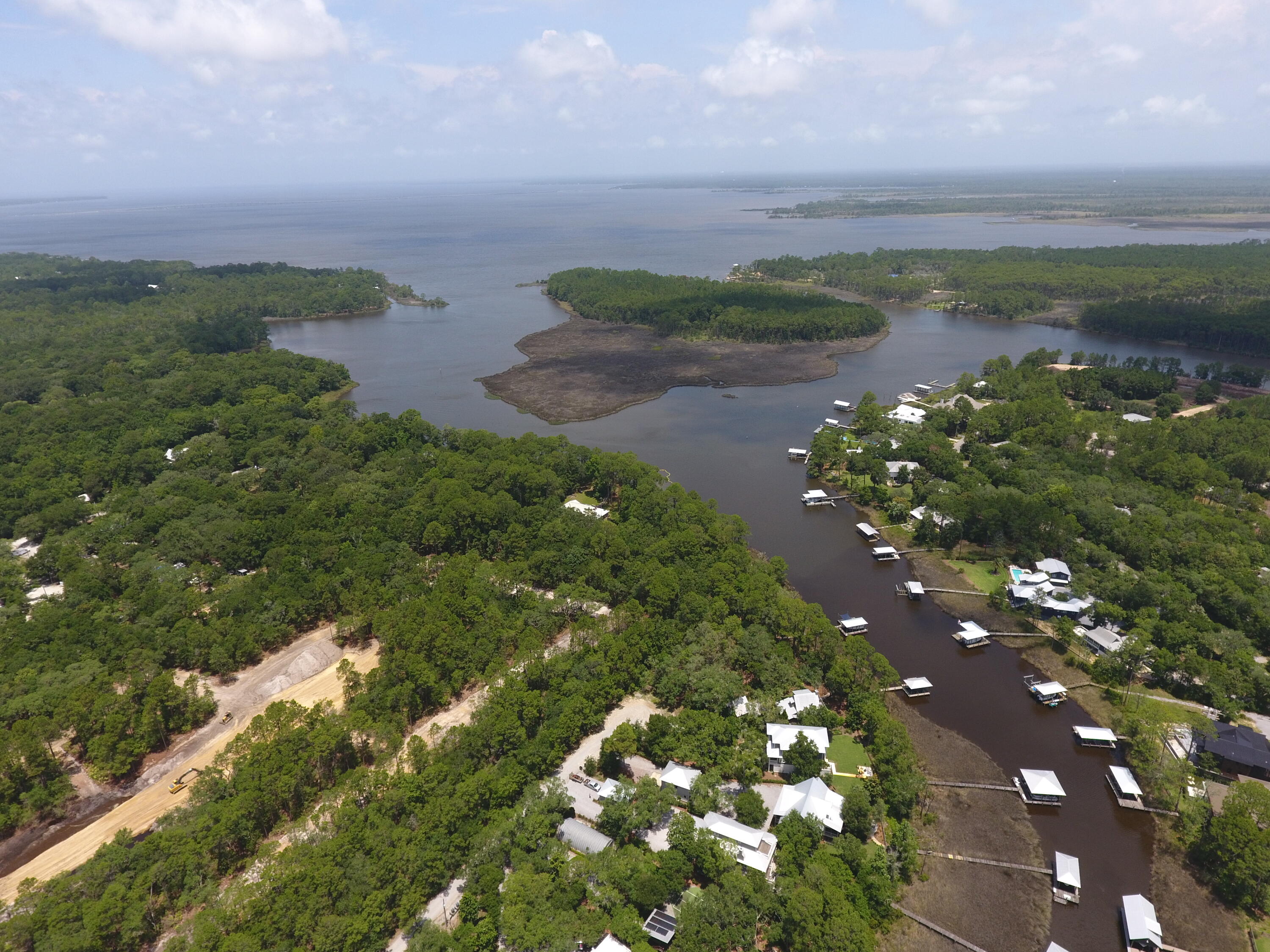 With Topographic Survey you are ready to build your waterfront oasis.  Welcome home to Lot 2 Dog Hobble Lane where old Florida serenity meets the 30A Lifestyle.  
Imagine waking up to the gentle rustle of ancient magnolias and grand live oaks, the morning sun filtering through a canopy of mature pine trees. You walk out to your backyard, drink in hand, and step directly onto your private dock. This isn't just a lot; it's the canvas for your legacy.  Upland buildable is 50X340X180X165 more than enough for a home with a pool and yard.  

Tucked away in the historic, deeply charming enclave of Point Washington, this rare canal-front homesite on Tucker Bayou offers an escape from the ordinary. Here, in the quiet, tree-lined sanctuary of Eden Estates, the fast-paced world fades away. With no restrictive HOAs to dictate your vision, you have the ultimate freedom to design and build the exact dream home, boat house, dock, peaceful second-half retreat, or premier investment property as your heart desires.

The ultimate gateway to water and coastal wonder
Your backyard is a launchpad for daily adventure. Seamlessly transition from a quiet morning paddleboard or kayak on the glassy canal to a sunset boat cruise out into the expansive Choctawhatchee Bay.  This lot has direct access to the intracoastal waterway for a nice boat ride to Panama City, Shell Island or just a leisurely cruise.  

Near Eden Gardens State Park where the history and the amazing Azalea blooms will etch in your memory for a lifetime.  

While you are enveloped in natural privacy and complete serenity, you are never isolated. This exceptional location bridges the gap between hidden-gem tranquility and world-class luxury as you are minutes from 30A, dive into the pristine, sugar-white sand beaches of the Emerald Coast, vibrant boutique shopping, and celebrated fine dining that defines the 30A coastline.

Active coastal living with immediate access to scenic bike paths and some of the Gulf Coast's most challenging, beautifully designed golf courses.

Effortless connectivity, centrally located with easy access to Highway 98, putting the energy of Destin and Panama City Beach, as well as the Northwest Florida Beaches International Airport, within easy reach.  Fiber optic internet is available on this lot!  

The South Walton area is growing beautifully, making pristine waterfront gems like this incredibly hard to find. Don't just build a house--claim your piece of the historic Florida landscape and craft a lifestyle defined by water, woods, and wonder. Your Eden is waiting.  

Call or text for more information.  

All information and measurements are deemed accurate but should be verified by the buyer.