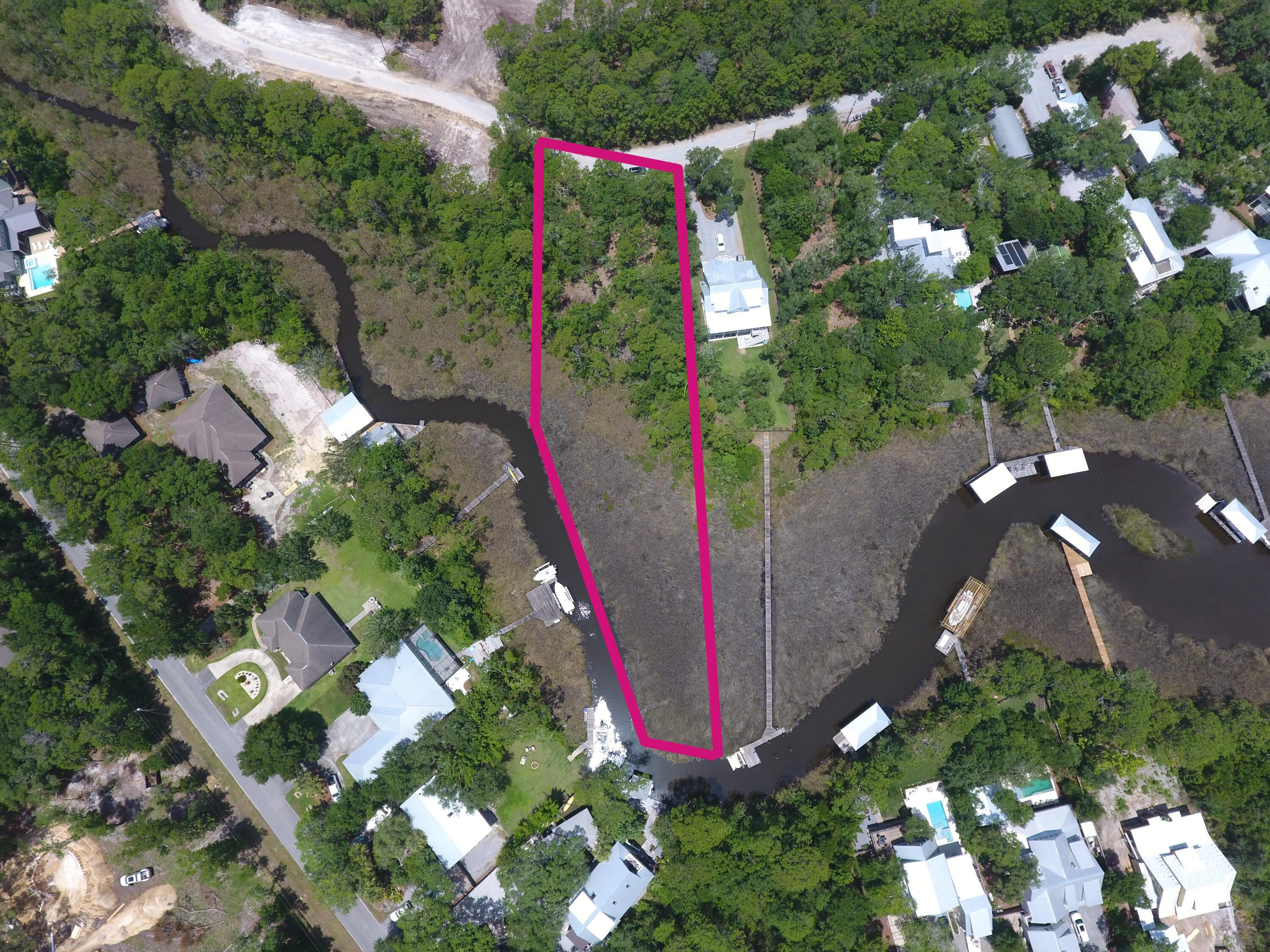 Welcome home to Lot 2 Dog Hobble Lane where old Florida serenity meets the 30A Lifestyle.  
Imagine waking up to the gentle rustle of ancient magnolias and grand live oaks, the morning sun filtering through a canopy of mature pine trees. You walk out to your backyard, drink in hand, and step directly onto your private dock. This isn't just a lot; it's the canvas for your legacy.  Upland buildable is 50X340X180X165 more than enough for a home with a pool and yard.  

Tucked away in the historic, deeply charming enclave of Point Washington, this rare canal-front homesite on Tucker Bayou offers an escape from the ordinary. Here, in the quiet, tree-lined sanctuary of Eden Estates, the fast-paced world fades away. With no restrictive HOAs to dictate your vision, you have the ultimate freedom to design and build the exact dream home, boat house, dock, peaceful second-half retreat, or premier investment property as your heart desires.

The ultimate gateway to water and coastal wonder
Your backyard is a launchpad for daily adventure. Seamlessly transition from a quiet morning paddleboard or kayak on the glassy canal to a sunset boat cruise out into the expansive Choctawhatchee Bay.  This lot has direct access to the intracoastal waterway for a nice boat ride to Panama City, Shell Island or just a leisurely cruise.  

Near Eden Gardens State Park where the history and the amazing Azalea blooms will etch in your memory for a lifetime.  

While you are enveloped in natural privacy and complete serenity, you are never isolated. This exceptional location bridges the gap between hidden-gem tranquility and world-class luxury as you are minutes from 30A, dive into the pristine, sugar-white sand beaches of the Emerald Coast, vibrant boutique shopping, and celebrated fine dining that defines the 30A coastline.

Active coastal living with immediate access to scenic bike paths and some of the Gulf Coast's most challenging, beautifully designed golf courses.

Effortless connectivity, centrally located with easy access to Highway 98, putting the energy of Destin and Panama City Beach, as well as the Northwest Florida Beaches International Airport, within easy reach.  Fiber optic internet is available on this lot!  

The South Walton area is growing beautifully, making pristine waterfront gems like this incredibly hard to find. Don't just build a house--claim your piece of the historic Florida landscape and craft a lifestyle defined by water, woods, and wonder. Your Eden is waiting.  

Call or text for more information.  

All information and measurements are deemed accurate but should be verified by the buyer.