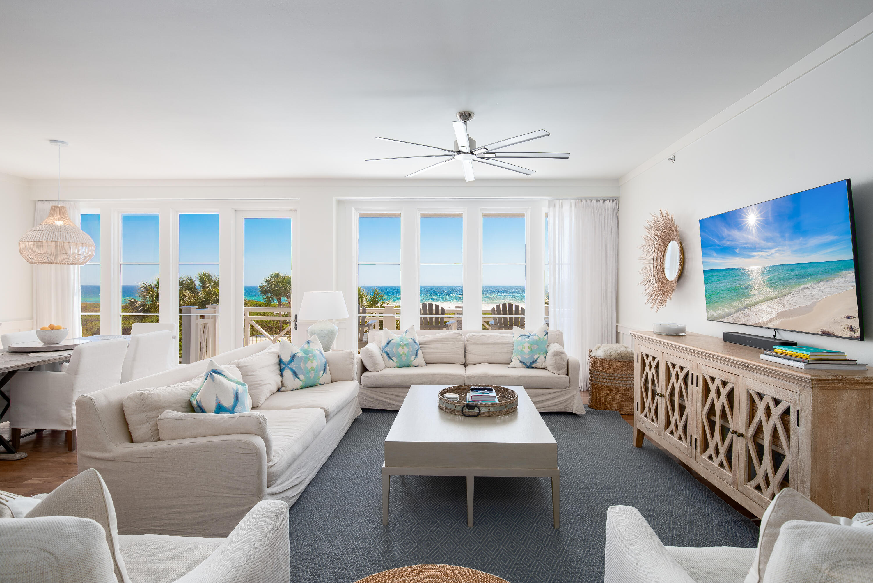 This stunning third-floor condominium in WaterSound Beach offers a rare combination of breathtaking gulf views, effortless luxury and the ease of a low-maintenance lifestyle. Recently remodeled by Urban Grace Interiors, the residence features new furniture, fresh paint, custom wallpaper, designer lighting and curated artwork, creating a refined coastal retreat. Thoughtfully designed for comfort and style, this three-bedroom, three-bathroom residence spans 1,980 square feet and is one of the few units in the community that directly overlooks the pool and outdoor fireplace, offering unparalleled views of the Gulf of America. An open-style gourmet kitchen anchors the home, complete with a suite of stainless-steel appliances, a wine cupboard and an oversized center island perfect for casual