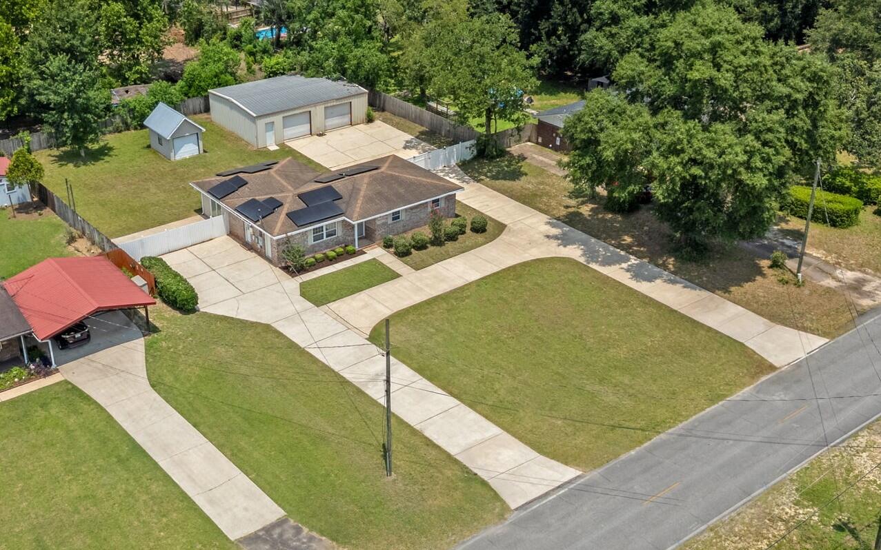 If you've been searching for a property with room to spread out, endless parking, and an incredible workshop, 1309 Valley Road is the one you've been waiting for.

Situated on a half-acre lot, this 3-bedroom, 2-bathroom home offers 1,680 square feet of living space with features that set it apart. The circular horseshoe driveway and oversized parking area provide ample room for cars, trucks, RVs, boats, trailers, and more.

The impressive 1,200-square-foot metal shop is a dream for hobbyists, mechanics, small business owners, or anyone needing extra workspace and storage. An additional detached garage provides even more room for tools, lawn equipment, or seasonal items.

Inside, you'll find new flooring throughout and a spacious living room with durable tile flooring, creating a comfortable space to gather with family and friends. Step outside to enjoy the fully fenced backyard, offering privacy and plenty of room for kids, pets, or entertaining.

To top it off, the seller is offering a new roof with an acceptable offer, adding even more value and peace of mind for the next owner.

Properties with this much outdoor space, parking, and workshop potential are hard to find. Don't miss your chance to make 1309 Valley Road your next home! This home offers a VA Assumable 2.75% mortgage!