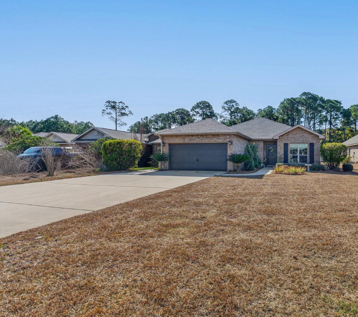 One of the LARGEST LOTS in Driftwood Estate Phase Two! This one story 3Br/2Ba brick home sits on over ¼ acre lot. *This home has been owned by the same family and is smoke and pet free. New dishwasher and stove installed February 2026. Refrigerator approx. 7-month, dryer approx. 3yo. Very reduced electricity bill. The home comes with a solar system paid off by seller at closing and a home warranty. The split-bedroom floor plan offers privacy. There's a raised snack bar, and the formal dining room could easily be used as an office or a fourth bedroom (no closet). The master suite includes a separate shower and garden tub. The garage opens to a long driveway with space to park 4 more cars. Driftwood Estate is a desirable and family-oriented community with Park area, playground, tennis courts, large community pool, basketball court, soccer field, and a catch-and-release pond. Reasonable HOA. Just minutes from Publix, Grand Boulevard shopping and entertainment, medical facilities, and Sandestin Resort with world-class golf, beaches, and dining. Short drive to State Park and Preserve, with over 3 miles of uncrowded beach access and two large coastal dune lakes. Short drive to other public beaches, access along 30A or Miramar Beach and Destin. Don't miss this opportunity. Schedule your showing today! All information and measurements are deemed accurate but should be verified by the buyer.