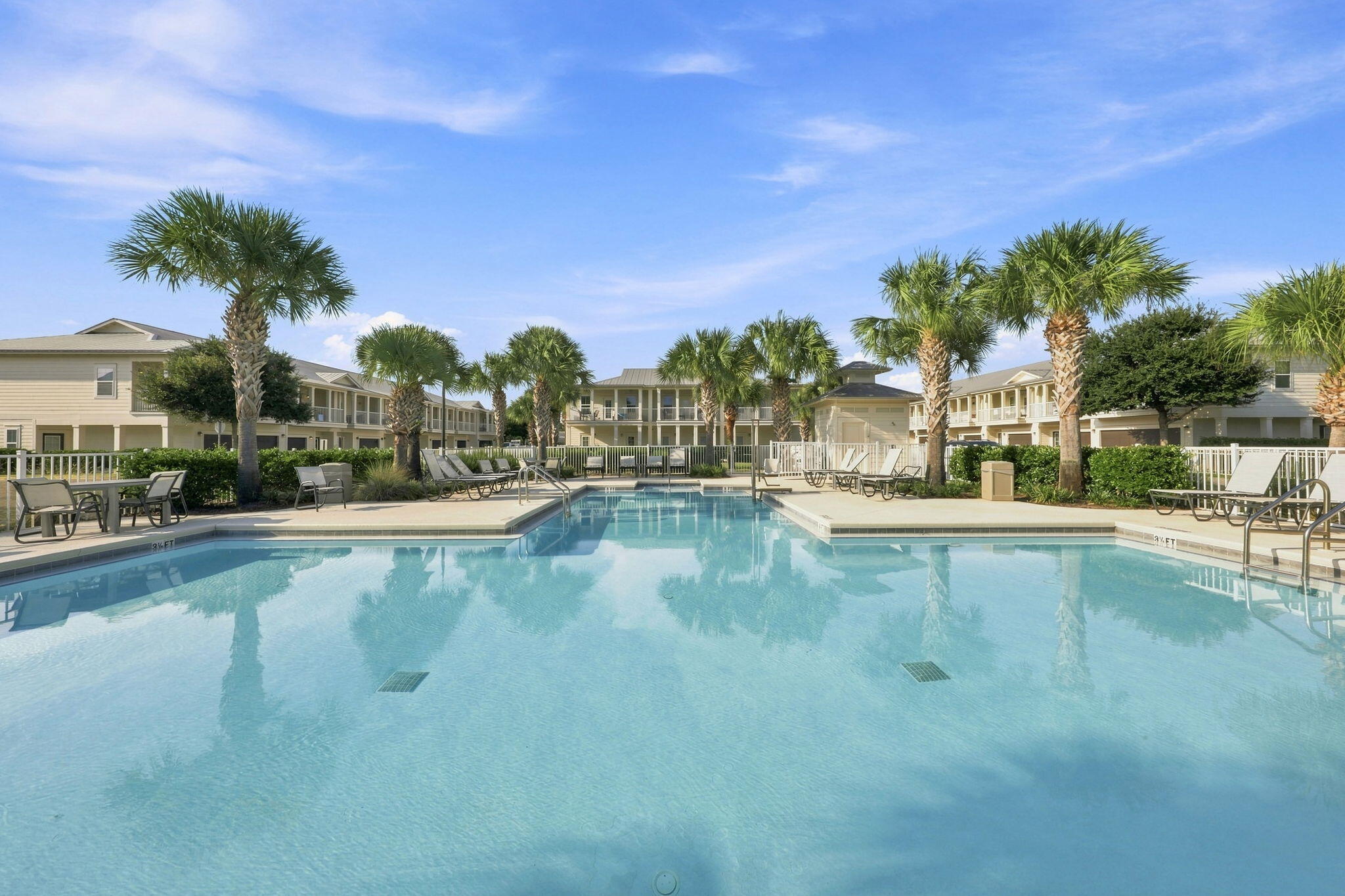 A location that can't get any better! Positioned in the heart of Crystal Beach, 125 Crystal Beach Drive, Unit 114 offers the ultimate Destin lifestyle just steps from sugar-white sands and emerald waters. This premier beachside address puts Destin's top shopping, dining, and entertainment destinations within easy reach--including Destin Commons, Whole Foods, Destin Harbor, HarborWalk Village, Big Kahuna's Water & Adventure Park, The Track, and many more.
Pair that location with a proven track record generating approximately $70,000 in annual gross rental income and exceptionally low HOA fees, and this beautifully updated 3-bedroom, 2.5-bath townhome is truly the whole package. Set within one of Destin's most sought-after resort-style communities, residents and guests enjoy a heated pool, dog park, and lush green space. This is coastal living done right.
Step inside to a fully furnished, West Elm-inspired interior where every detail feels curated--polished, breezy, and unmistakably beach-house chic. Turnkey doesn't get much more turnkey than this.
The smart reverse floor plan optimizes every square foot. Two guest bedrooms are located downstairs, including a bunk room that provides additional sleeping space, along with a full bathroom and access to the rear patio. Upstairs, the main living level brings the kitchen, dining, and living spaces together in an open layout with granite countertops, stainless steel appliances, and plenty of room to gather. The private primary suite is also located upstairs and includes a walk-in closet and private bath. Just off the living area, a covered balcony with a porch swing creates an inviting extension of the living space--perfect for morning coffee or relaxing after a day at the beach. A private one-car garage provides convenient space for a vehicle, golf cart, bikes, paddle boards, and beach gear, complemented by two additional parking spaces directly in front and guest parking throughout the community. Whether your goal is a high-performing investment, an effortless second home at the beach, or a little of both, Unit 114 offers a rare combination in today's Destin market. 
Don't miss the opportunity to make this Crystal Beach townhome part of your Destin story!