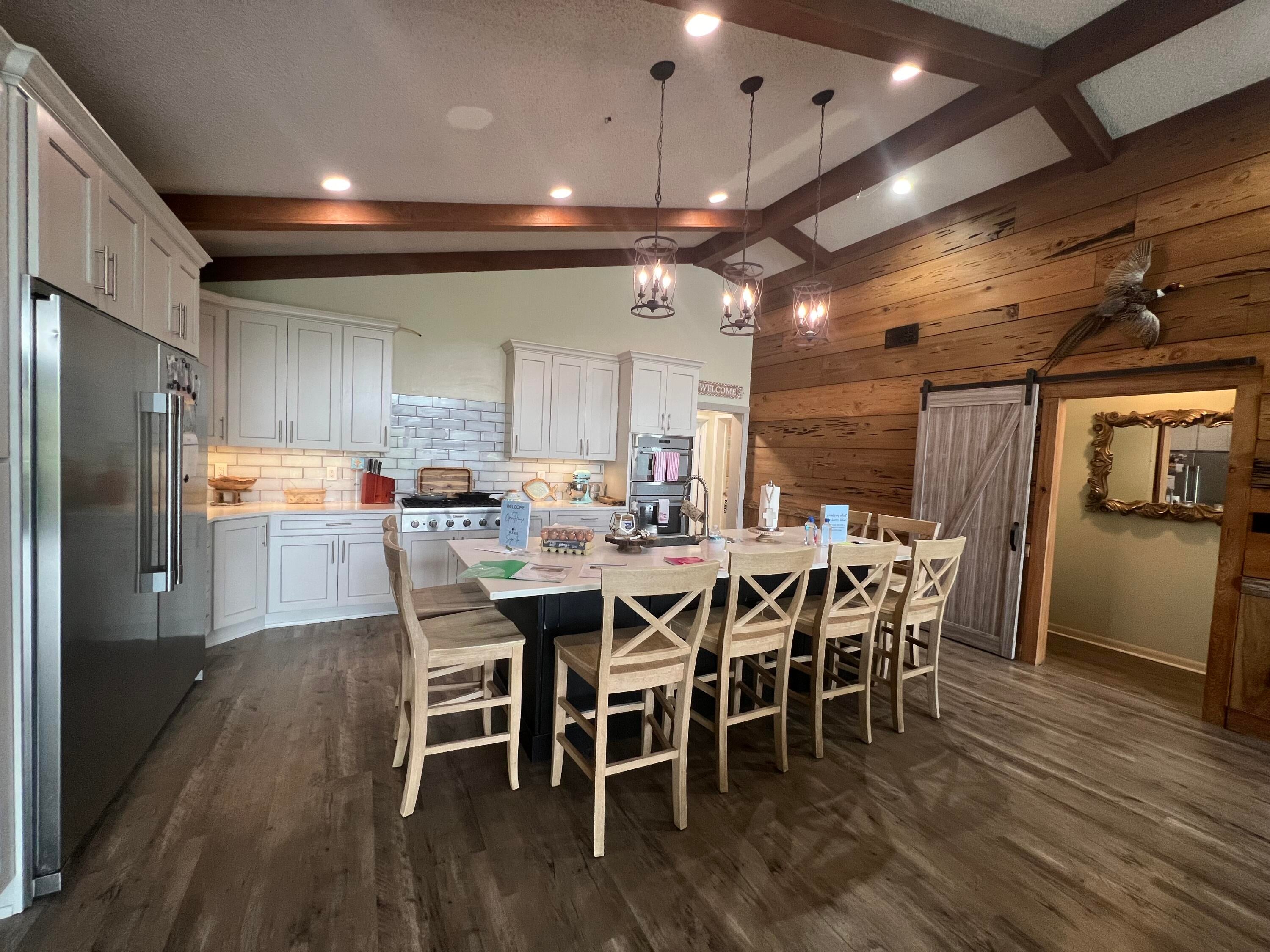 Unlimited possibilities can make all your dreams come true on the Bayou at 5 Poquito.

Poquito Bayou, known for its unique homes, larger lots, no HOA, community boat ramp & playground, is conveniently located near Eglin AFB, schools, shopping, dining, parks & area beaches. This property offers modern updates & added flexibility in one of the most beautiful & established communities.

Spectacular sunrises & stunning sunsets are the perfect setting for life here. From the moment you arrive, you'll find something for everyone & every lifestyle. Extra living space can be found in the charming 2-bedroom, 1-bath guest cottage with small kitchen--perfect for guests, a mother-in-law suite or office. The cottage has easy access to the main house with 3 bedrooms & 2 baths.

The recently updated kitchen features an exceptional island seating up to 8. The open living area includes a cozy gas fireplace, pecky cypress accent wall & expansive floor-to-ceiling windows & glass door framing your first views of the Bayou below.

This home's design will not disappoint, with outdoor spaces on different levels--from the wooden deck to the stone patio & finally to the deep-water boat dock with ample decking for fishing, swimming or relaxing. Looking back up at the house showcases an elevation unequalled in most coastal homes. This property was made to be enjoyed & celebrated by you, your family & friends.

Updates: Kitchen/layout (2021/2022) | HVAC (2024) | Roof (2015) | Water heater (2015)