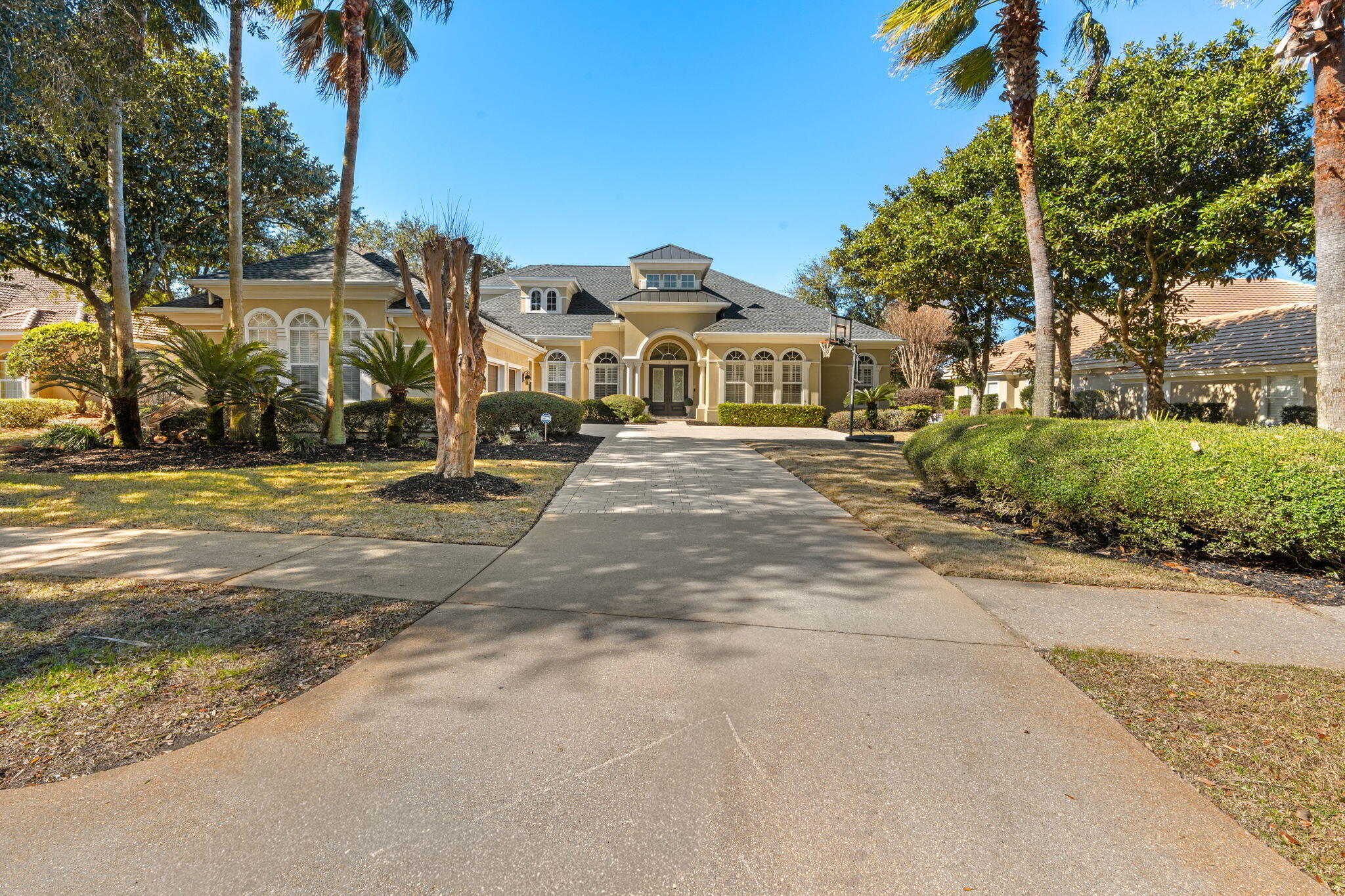 Welcome to exceptional living in Kelly Plantation! This stunning custom-built residence offers an impressive 4,119 square feet of beautifully designed living space, featuring 5 bedrooms, a first-floor primary suite, dedicated office, and an oversized media room--providing the perfect blend of elegance, comfort, and functionality.
Ideally positioned directly on the 17th-hole tee box of the renowned Kelly Plantation Golf Course, this home captures beautiful golf-course views and offers a setting that is both peaceful and picturesque. Inside, 12-foot ceilings, abundant natural light, and plantation shutters throughout create an open, sophisticated atmosphere.
The spacious open-concept design is ideal for both everyday living and entertaining, with the gourmet kitchen flowing seamlessly into the expansive living and dining areas. Beautiful upgraded hardwood flooring in the bedrooms adds warmth and character, complementing the home's refined finishes. 
The first-floor primary suite provides a private retreat, while the additional bedrooms, dedicated office, and large media room offer plenty of space for family, guests, work, and entertainment.
Located within the highly desirable Kelly Plantation community, this exceptional home combines generous living spaces, timeless design, and a premier golf-course setting. A rare opportunity to enjoy the best of Destin living in one of the area's most sought-after communities.
No Flood Insurance Required! Freshly painted inside and out. New roof 2024.
Resurfaced swimming pool with new pool pump.