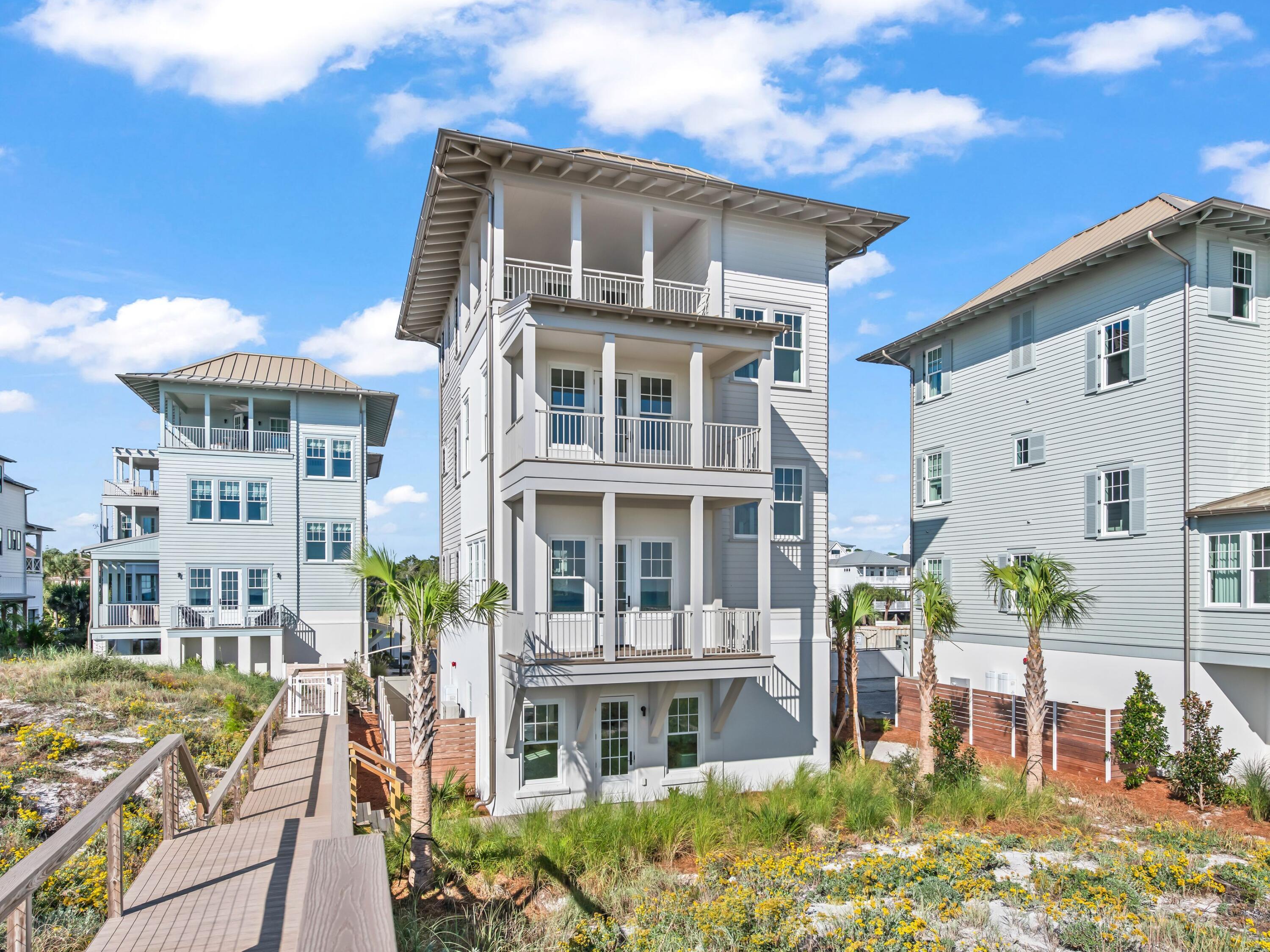 Located within the intimate, architecturally curated enclave of Lupin Beach in Inlet Beach, Lot 3 offers a rare blend of new Gulf-front construction, refined coastal design, and exceptional value along the coveted eastern end of Scenic 30A. Positioned as the second-most western Gulf-front residence in this boutique community, the home delivers a highly desirable layout that lives comfortably while maximizing Gulf orientation and natural light.

This three-bedroom, three-and-two-half-bath residence spans 2,300 square feet, introduced by a calming neutral exterior palette that embodies timeless coastal elegance. Inside, gold and brass-toned fixtures, premium appliances, and elevated material selections shape an atmosphere of warm sophistication. The thoughtful floor plan balances openness with functionality, creating an effortless flow through beautifully composed interior spaces.

Outdoor living is expressed through a series of architectural moments that celebrate the Gulf's presence. The top-floor covered balcony provides generous seating space, steady breezes, and an intimate vantage point over the water--ideal for morning rituals or evening unwinding. Additional Juliette balconies on the southern and western elevations welcome abundant natural light and capture charming view corridors toward the shoreline and sunset.

Adjacent to the two-car garage, a covered transitional space features a built-in kitchenette designed for practical everyday use--perfect for preparing refreshments, or supporting coastal living with ease--without serving as a full summer kitchen.

Beyond the residence, the home's location on the eastern edge of Inlet Beach offers unmatched access to both protected natural beauty and the celebrated destinations of the 30A corridor. Steps away, Lake Powell, one of Florida's largest coastal dune lakes, provides opportunities for paddle boarding, kayaking, fishing, and serene exploration. Immediately to the east, Camp Helen State Park offers hiking trails, a fishing pier, wildlife viewing, and seasonal community programming within a preserved natural setting.

Within minutes, owners can enjoy the world-class boutiques, dining, and cultural events of Rosemary Beach, Alys Beach, Seacrest Beach, and the emerging offerings at Kaiya Beach Resort. Premier club and recreation options are also close by, including Watersound Beach Club, the expansive new amenities at Camp Creek, and Wild Heron Golf Club with its marina, restaurant, fitness facilities, and outdoor activities.

Travel convenience is another hallmark of this location, with Northwest Florida Beaches International Airport (ECP) just 15-20 minutes away, offering direct flights to major markets such as Atlanta, Dallas, Nashville, Charlotte, Miami, and New York.

Now fully completed and ready for immediate occupancy, Lot 3 stands as one of the most compelling Gulf-front opportunities on eastern 30A--blending thoughtful design, intimate community living, and the rare privacy that defines Lupin Beach.