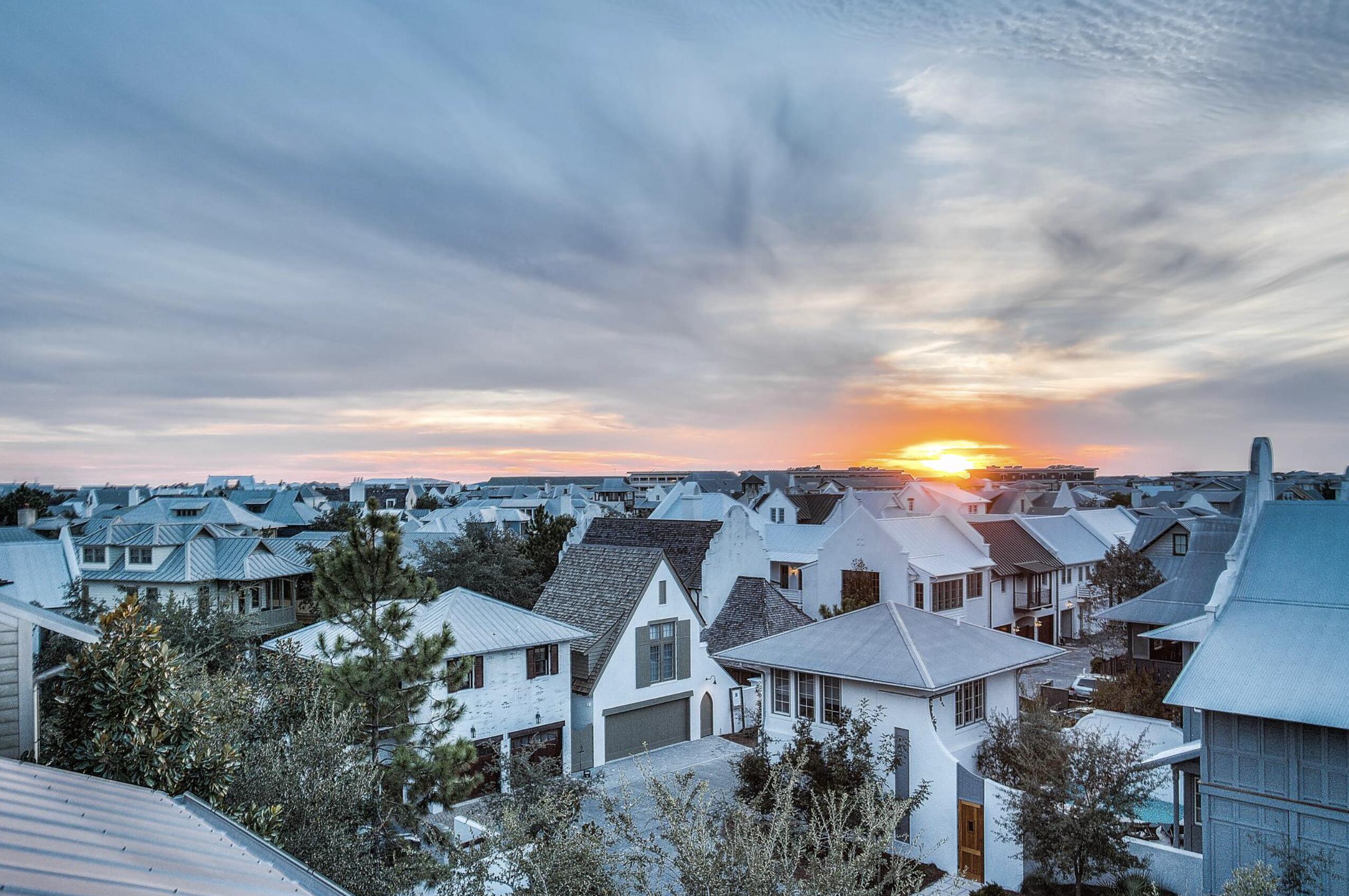 Welcome to 5 Johnstown Lane, an exquisite four-story home situated in the heart of Rosemary Beach that is the BEST PRICED HOME PER SQUARE FOOT on the market in Rosemary Beach! And to top it off, the highly-motivated seller is offering a $40,000 CONCESSION towards upgrades and improvements! Overlooking the St. Augustine Green in Rosemary Beach, this fully-furnished, elevator-equipped, four-story home is a must-see! Enjoy the panoramic views of the lush greenery and Rosemary Beach from every level, featuring balconies on the second, third, and fourth floors. One of our favorite features of this home is the wrap-around rooftop balcony. This is one of only 13 homes in Rosemary Beach with a tower designation, so the view over the hundreds of other homes is incredible! The allure continues with APPROVAL from the town architect for a PRIVATE POOL or CARRIAGE HOUSE to enhance the outdoor experience if desired.

With its reverse floor plan and wrap-around balconies, the only tough choice you'll make once you arrive is which views to enjoy and where.  This beautiful residence is light and bright, decorated in neutral colors and illuminated by natural light flooding in through the many windows. The rustic modern fixtures throughout complement the gorgeous dark wood floors beautifully. 

This lovely 4-story home is equipped with a private elevator and accommodates up to 15 people with 5 bedrooms, 4.5 baths, plus an additional bunk room; great for multiple families with over 3,500 sq ft of space. There are two guest suites and a wet bar on the first floor, each room complete with a king bed, private bath with custom tile shower, and a large closet. 

Another guest suite, as well as the master suite, can be found on the 2nd floor, each with a king bed, private bath, and walk-in closet. The master suite features a private balcony, a wet bar, double vanities, a large soaking tub with treetop views, and a custom tile shower. 

Continuing upward, the kitchen, living, dining and powder room are located on the 3rd floor with an open concept and an abundance of light. The kitchen is full of upgrades, including granite counter tops, a wine cooler, stainless steel decor, Kitchen Aid appliances, and a custom backsplash. There is another wrap-around balcony overlooking St. Augustine Green off the living room where the grill is located conveniently close to the kitchen. 

The fourth floor completes this residence with additional living space, a bunk room with three twin beds, and a wrap-around roof top balcony, where you can relax and enjoy sunset views and concerts in St. Augustine Park.

This home not only captures stunning views of the St. Augustine Green from every level, but is also in a great location. There is a water park with a splash pad for the kids and adults to cool off just beyond the front door. Not to mention the dining and shopping of Rosemary Beach's town square is a short 3 minute walk or quick bike ride away. Enjoy the exclusive amenities of Rosemary Beach, including four community pools, an owner's-only club just steps away from 5 Johnstown Lane, tennis courts, expansive green spaces, a gym, fitness trails, and much more. 

Come discover a world of luxury, comfort, and relaxation in this Rosemary Beach retreat!