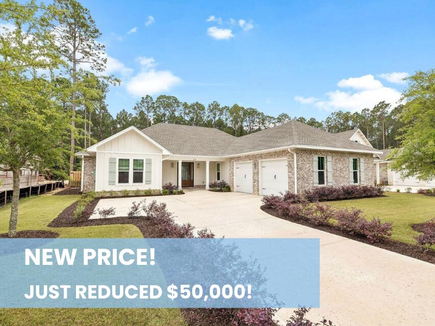 Seller is offering $10,000 toward Buyer closing costs with an acceptable offer! Tucked within the gated bayfront community of Steamboat Landing at Hammock Bay, this thoughtfully designed, CUSTOM, single-level residence offers an exceptional combination of privacy, functionality, and indoor-outdoor living. Positioned on a large homesite backing to a serene wooded buffer, the property enjoys a peaceful setting with a spacious fenced backyard designed for both entertaining and everyday enjoyment. Beautiful landscaping and a welcoming approach set the tone upon arrival, while the attached two-car garage and well-planned layout provide effortless convenience. The expansive backyard is a standout feature, complete with a large paver patio and grilling area, dedicated fire pit space, and an oversized screened porch with ample room for both dining and lounging, all overlooking the private natural backdrop. Inside, the home's flowing floor plan was designed with both comfort and connection in mind. A welcoming foyer opens into the spacious living room, anchored by a built-in brick fireplace, before seamlessly transitioning into the dining area and stunning kitchen beyond. The kitchen serves as the heart of the home with a large center island, gas range, range hood with natural wood accents, neutral tile backsplash, and an oversized walk-in pantry.  Large windows throughout the living, dining, and kitchen spaces create a bright and inviting atmosphere while offering uninterrupted views of the backyard and wooded surroundings. Positioned at the rear of the home for maximum privacy, the primary suite overlooks the backyard and wooded buffer and features dual vanities, a walk-in shower, and a spacious walk-in closet. Two additional guest bedrooms each include walk-in closets and share a Jack-and-Jill style bathroom, while a separate powder bath adds convenience for visitors. Privately situated off the kitchen, a mudroom hallway and laundry area connect to a secluded fourth bedroom featuring its own ensuite bath and generous walk-in closet, ideal for guests or multigenerational living. Residents of Steamboat Landing at Hammock Bay enjoy an amenity-rich lifestyle with access to the expansive community offerings. Steamboat Landing provides a more intimate bayfront setting complete with a waterfront clubhouse, dock, and picturesque walking trails shaded by mature oak trees. Hammock Bay further enhances the lifestyle experience with multiple pools including two zero-entry resort-style pools, a traditional lap and recreation pool, a state-of-the-art 10,000-square-foot fitness center, more than 12 miles of trails and bike paths, playgrounds, lighted pickleball and tennis courts, and a basketball court, the popular Props Brewery, and a community amphitheater.