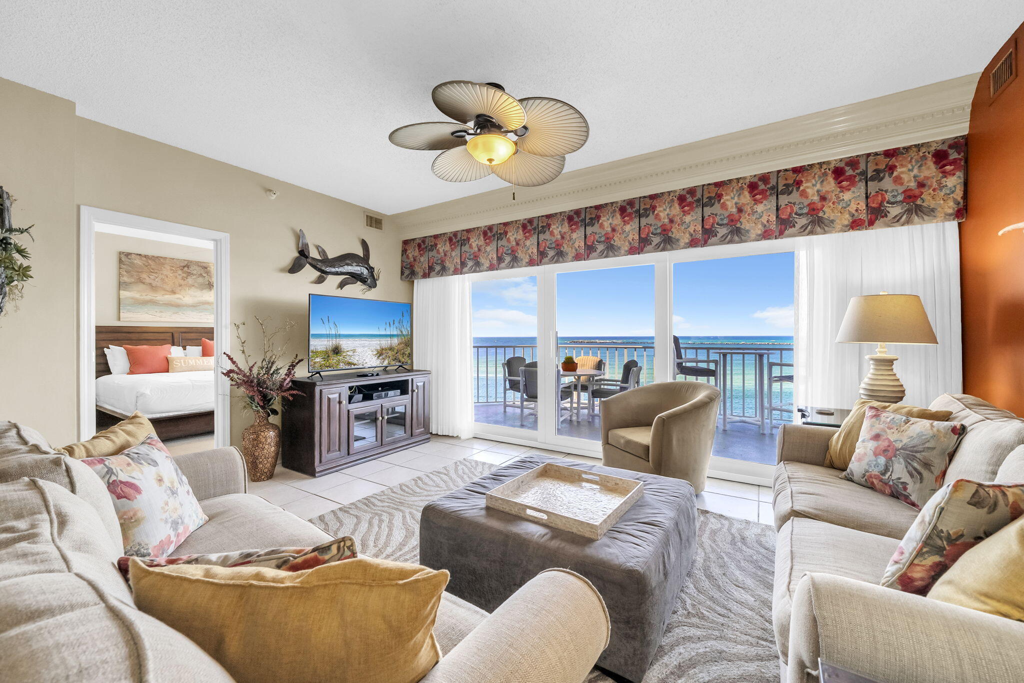 Wake up to dolphins playing in the waves and watch Thursday night fireworks light up the sky right from your own balcony. This 5th-floor gem at Waterview Towers Yacht Club sits in one of Destin's most coveted spots on Holiday Isle, with panoramic views of the East Pass, the Jetties, and the emerald-green Gulf.

The open floor plan flows seamlessly from living room to dining area to kitchen, anchored by floor-to-ceiling sliding glass doors that open onto a spacious balcony with raised seating, perfect for morning coffee with a view. The kitchen is fully equipped with full-size appliances, an in-unit washer/dryer, and generous granite counters ready to host a feast for six.

Three bedrooms offer flexibility and comfort: a guest room with two twin beds, ceiling fan, and flat-screen TV; a second guest suite with a king bed, ceiling fan, view, and adjacent private bath; and a master retreat with a king bed, ceiling fan, and stunning views, plus an en-suite bath featuring a double-sink vanity, soaking tub, and separate shower.

Head downstairs to the pool and hot tub, or take the private gated path to the public beach access. This unit includes Garage Unit #3 and Storage Unit #3 -- rare, valuable extras on Holiday Isle.