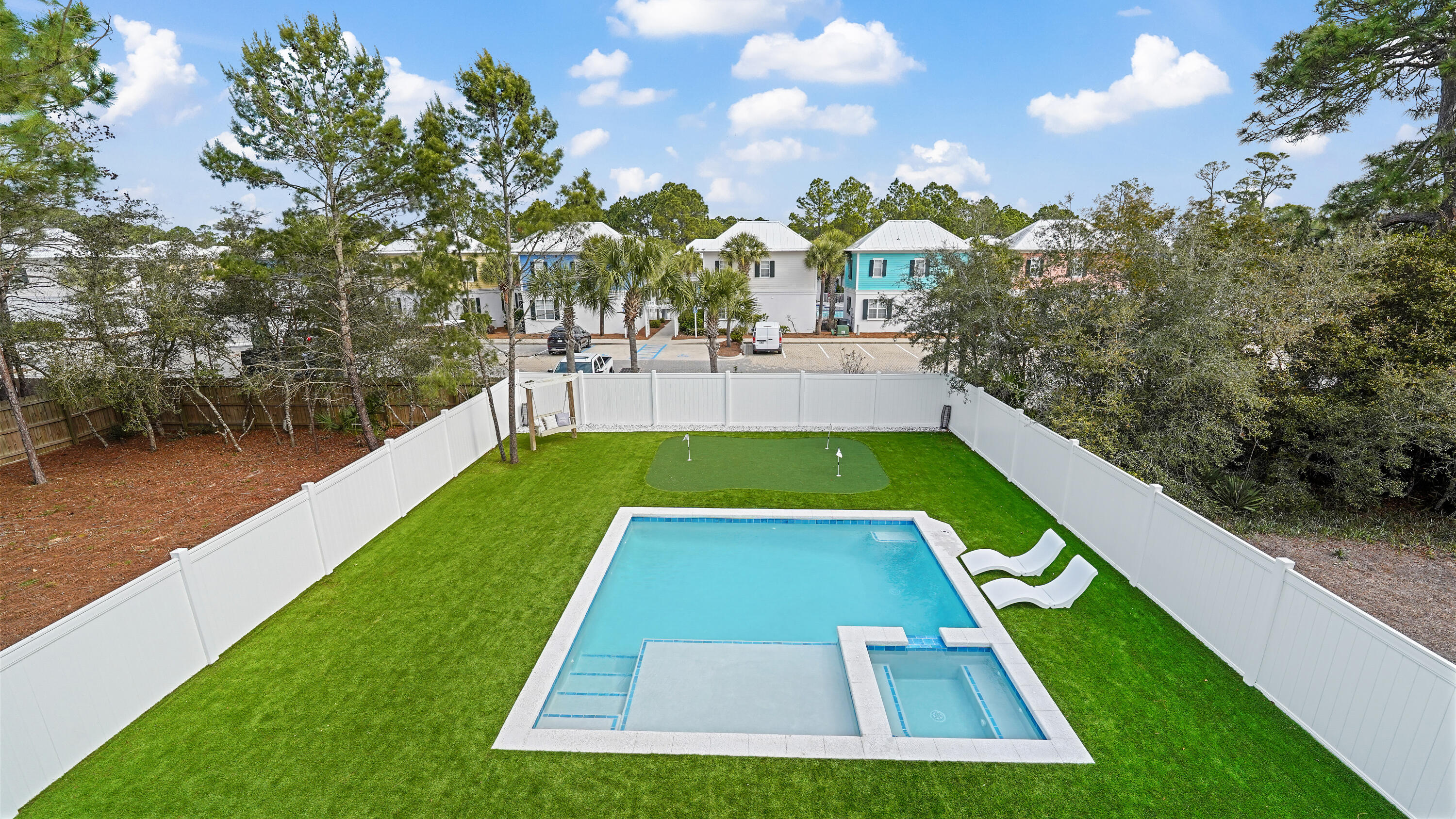 Tucked away on a private street in the heart of Seagrove Beach, 65 Sand Dollar Court presents a rare opportunity to own a fully furnished, never-rented coastal retreat just moments from the beach access.
This owner-occupied residence exudes quality and sophistication, featuring rich hardwood flooring throughout, thoughtfully designed ensuite bathrooms, and timeless plantation shutters that elevate both style and privacy. Every detail reflects pride of ownership and a level of care seldom found in today's market.
Step outside to a truly exceptional backyard oasis--fully fenced for privacy and designed for both relaxation and entertainment. Enjoy a brand-new heated in-ground pool, low-maintenance turf, and a custom putting green, creating a resort-style experience that appeals to all.