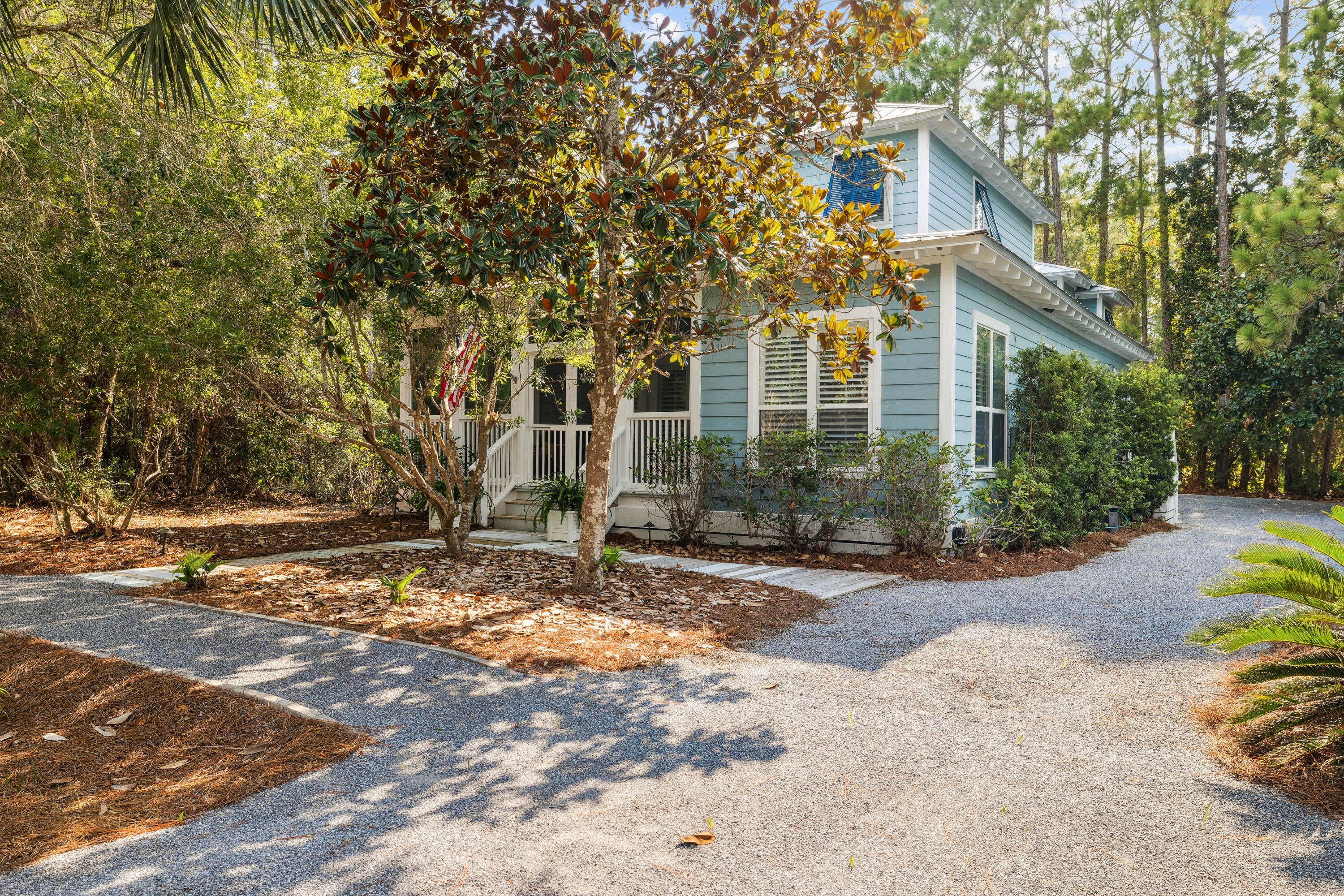 298 Cullman is the picture of what you envision when you think of a Seagrove Beach home with inviting porches and a relaxed feel that echos the 30A mantra ''slow down, you're here.'' The home is a picturesque beachside cottage nestled within the longtime favorite community of Grove by the Sea.  The Grove has seen minimal turnover over the years as many owners find it hard to leave the rare combination of convenience and privacy found here. The community is almost hidden in plain sight in the heart of Seagrove Beach. Cherished by both full-time residents and vacationers, the neighborhood is known for its mature landscaping, winding gravel paths, and peaceful, tucked-away atmosphere--while still offering easy access to multiple nearby beach walkovers. Seaside, WaterColor, and the heart of 30A are just minutes away by bike or golf cart. Classic 30A favorites like Cafe 30A, Seagrove Market, Modica Market, Bud and Alley's and Seaside's ''airstream row'' are all close by. Enjoy quick access to the numerous concerts, move nights, farmers markets and special events held year round in Seaside and WaterColor. Take advantage of bike parking only at the 4 closest beach access points making beach access a breeze. A classic screened front porch sets the tone, creating an inviting space for morning coffee or quiet afternoons. Inside, the main living area is spacious and flexible, allowing for multiple seating arrangements ideal for gathering and entertaining. Adjacent to the living space, the kitchen and dining area provide a comfortable setting for shared meals and relaxed hosting.
The first floor features two guest bedrooms with a shared bath, offering convenience and privacy for visitors. Upstairs, the owner's suite occupies the entire second level and includes a generous bedroom, walk-in closet, en suite bath, and a private balcony an ideal retreat at the end of the day.
Adding exceptional versatility, the carriage house includes an oversized garage along with a fully equipped guest suite above, complete with a living area, kitchenette, bedroom, and bath perfect for guests or extended stays. The garage offers ample room for bikes, beach gear, and storage.
Residents of Grove by the Sea enjoy access to two community pools, including one just steps from the home. With a one-way-in, one-way-out layout and limited traffic, the neighborhood maintains a sense of privacy while remaining close to the vibrant energy of Seaside. Whether as a primary residence, second home, or coastal getaway, 298 Cullman Ave offers a timeless expression of classic Seagrove living.
