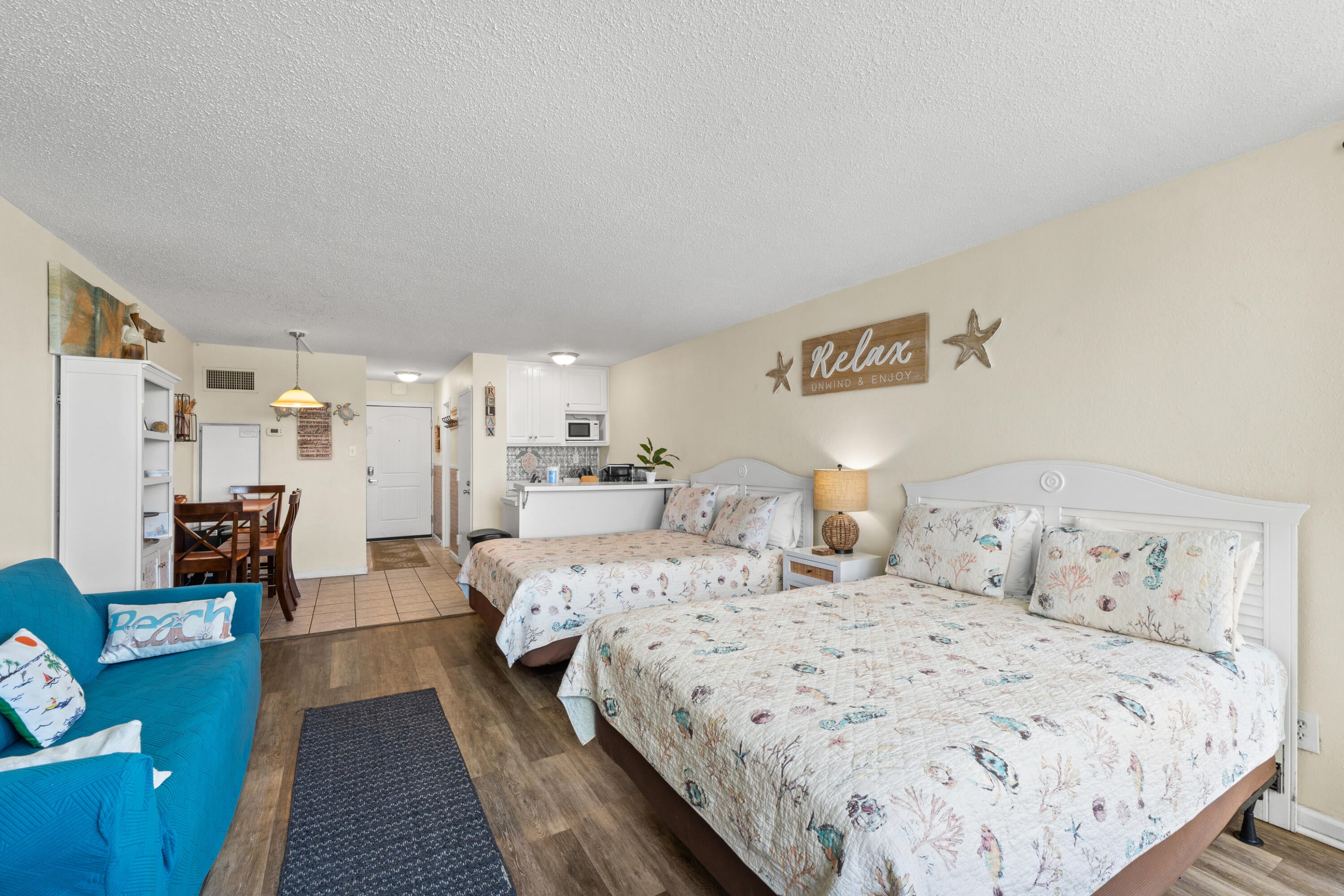 Welcome to Top of the Gulf, where the sugar-white sands and emerald waters of Panama City Beach are just steps from your door. This Gulf-front community offers direct beach access along with a large Gulf-front swimming pool, kiddie pool, seasonal snack bar, fitness center, game room, internet café, shuffleboard and cornhole, community laundry facilities, elevators, and outdoor gathering areas. Located on Thomas Drive, you're also convenient to local restaurants, golf, shopping, entertainment, and many of PCB's favorite attractions. Whether you're searching for a personal beach getaway, second home, or vacation rental opportunity, Top of the Gulf offers the location and amenities that keep owners and guests coming back to Panama City Beach. Now meet Unit A-418 -- a furnished and updated studio with beautiful Gulf views through floor-to-ceiling windows. The spacious layout features two Queen beds, comfortably sleeping up to four guests, along with coastal-inspired furnishings and durable luxury vinyl plank flooring. Sleeper sofa converts to a king-size bed, providing additional sleeping accommodations for guests. There is partial view of beach from unit. The unit also features a well-equipped kitchen, dedicated dining area, full bathroom with tub/shower combination, and a large owner's closet providing valuable storage for personal items between stays. Best of all, A-418 is offered furnished and is currently on a rental program, giving the next owner the opportunity to continue using it as a vacation rental or keep it as their own easy-to-enjoy beach retreat. Direct beach access, Gulf views, resort-style amenities, furnished and rental-ready -- A-418 puts the Panama City Beach lifestyle right at your fingertips.