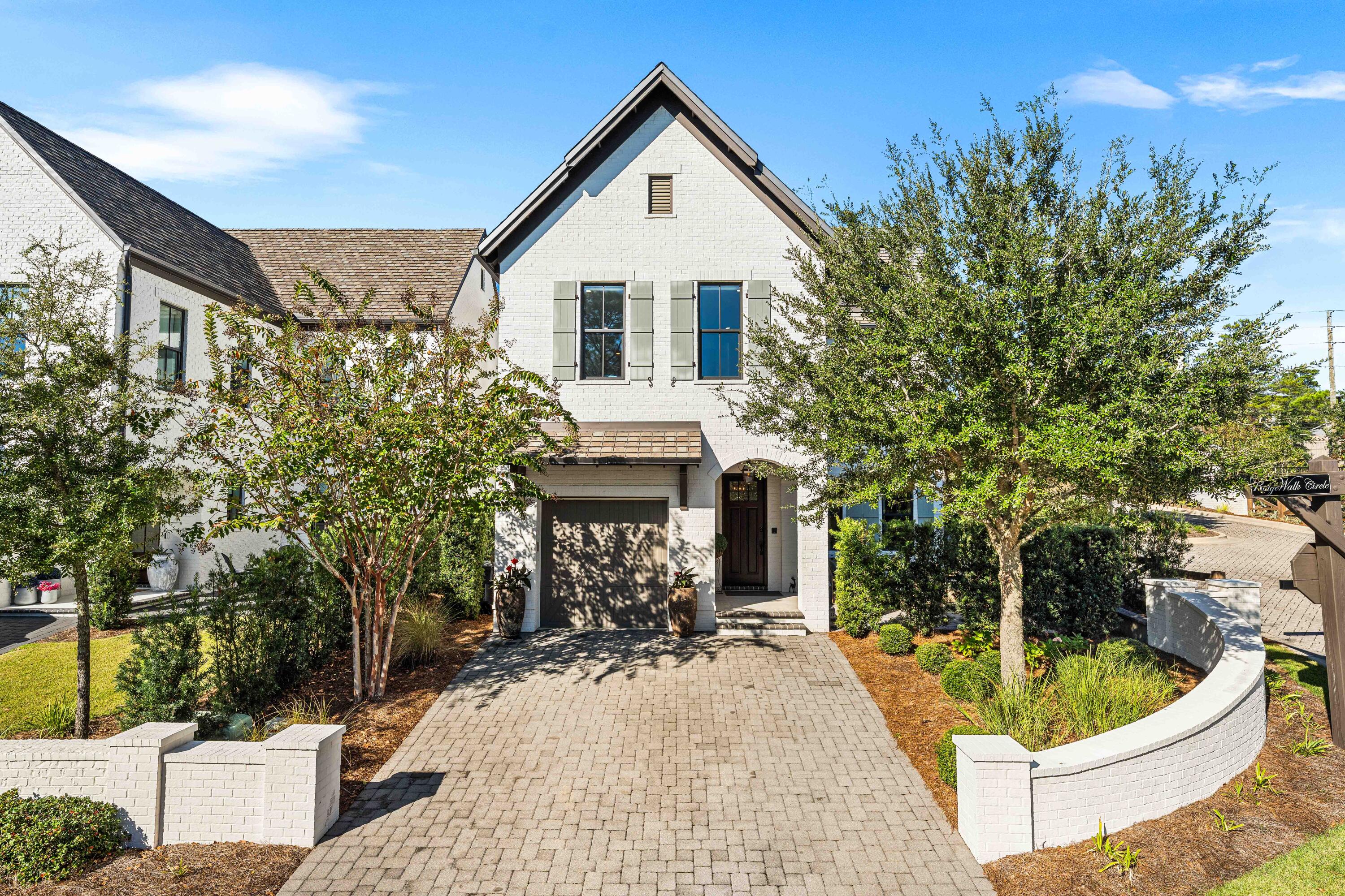 By far the best-valued opportunity in RidgeWalk--and the very first home ever built in this coveted community! Crafted by award-winning local builder Randy Wise, this French-inspired beauty blends elegance, craftsmanship, and coastal ease. Close enough to the Gulf to feel the salt air, it offers walkability to Ed Walline Beach Access, boutique shopping, favorite local eateries, and Gulf Place. Hardwood floors, 10' ceilings, smart-home features, and dual paved courtyards define easy luxury. No short-term rentals allowed--but long-term rentals permitted. Smart sellers have priced this one to move!