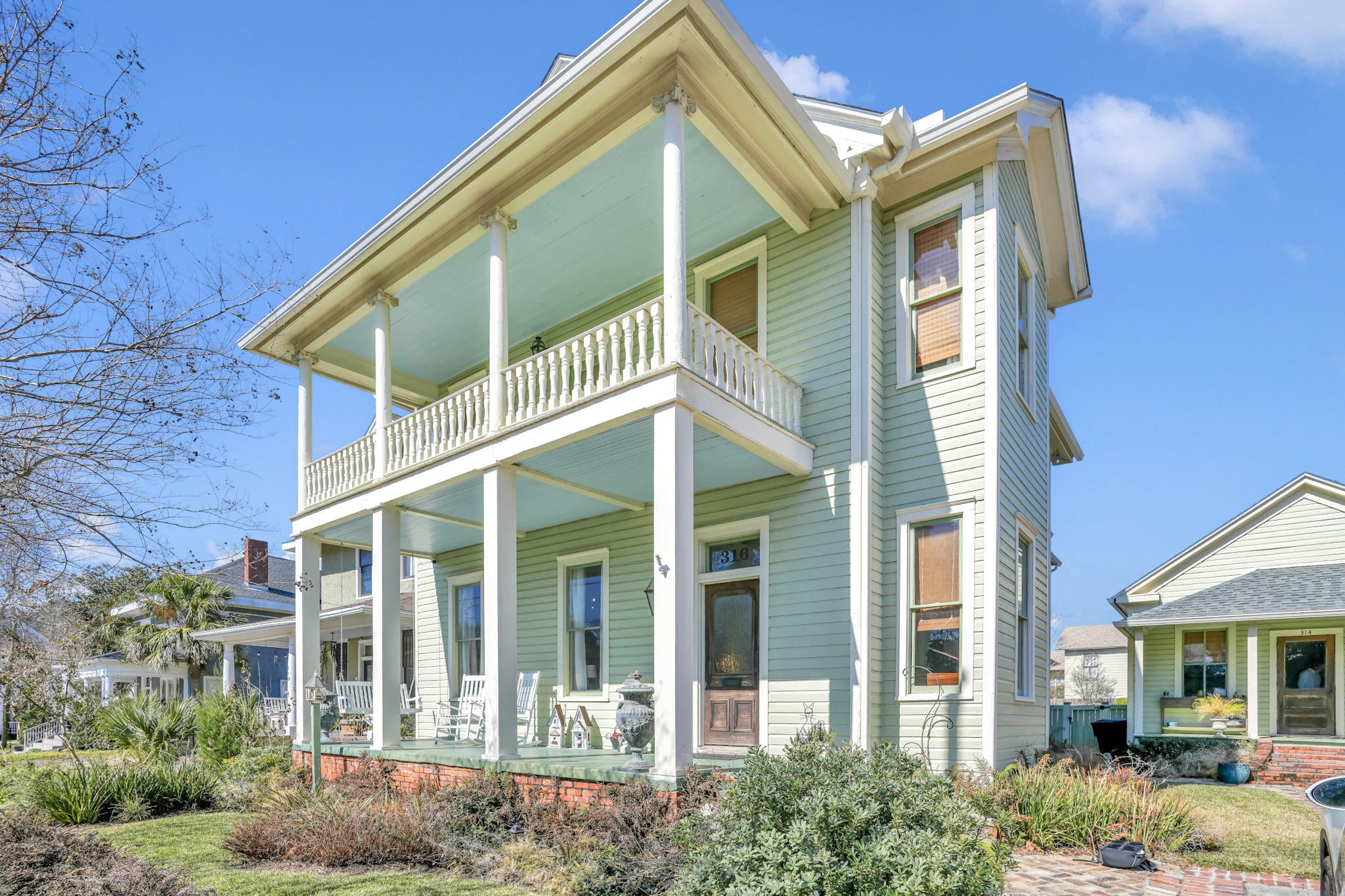 **MOTIVATED SELLER**. Masterfully Restored 1908 North Hill Estate with Historic Guest Cottage Discover an extraordinary opportunity in the heart of one of Florida's most prestigious historic districts. This award-winning property features a 3-bedroom, 2.5-bathroom main residence and a 1-bedroom, 1-bathroom guest cottage, one of the area's first schoolhouses, offering 3,681 combined square feet. Enter through a grand foyer where an antique stained glass window bathes the space in prismatic light. Original heart pine flooring flows beneath 13-foot ceilings, while custom 1800s millwork and pocket doors reveal craftsmanship of a bygone era. Period-authentic wavy glass windows, five-panel doors with brass hardware, and four gas fireplaces with antique mantles complete the historic narrative. Dual covered porches provide outdoor living space, with one offering views of Wahoo Stadium fireworks. The gourmet kitchen features Wolf and Sub-Zero PRO appliances, Italian Carrara marble countertops, and custom wood cabinetry. The primary suite delivers luxury with its own gas fireplace, spa-inspired ensuite bathroom with period-correct clawfoot tub and walk-in shower with dual showerheads, oversized walk-in closet with built-in organization, and adjacent laundry room.  The upstairs guest bathroom showcases period details including a cast iron wall-mount farmhouse sink and an expansive walk-in shower with integrated seating. The 651-square-foot cottage holds special significance as one of the area's first schoolhouses, McClay School House, now thoughtfully converted into a fully equipped residence. This versatile space offers strong short-term rental potential with projected annual income of $25,000, or serves beautifully as private quarters for extended family or visiting guests.
Expansive rear decking and paver patios create multiple zones for entertainment and relaxation, surrounding a pristine saltwater pool. Whether hosting summer gatherings or enjoying quiet morning coffee, these outdoor spaces feel like your own private resort.
Positioned within the North Hill Preservation District, a National Register of Historic Places neighborhood renowned for its architectural significance and walkability to downtown Pensacola's finest dining, cultural venues, and entertainment.
Please see attached documents for a comprehensive list of all upgrades and improvements this exceptional property has to offer.