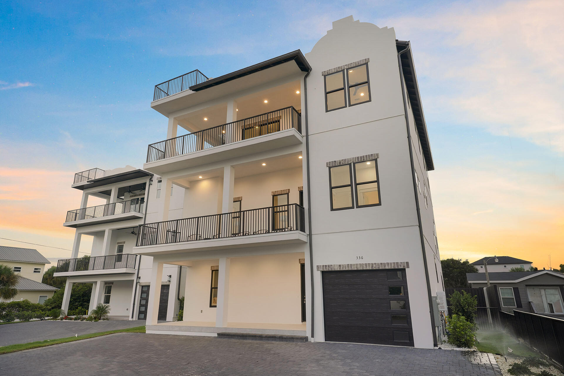 $350,000 RENTAL GUARANTEE is being offered on this property! Discover a stunning newly-built retreat just minutes from the Gulf's white sands. Spanning over 5,100 sq ft across three levels, this 9-bed, 9.5-bath home features multiple living areas, a private elevator, garage, and a resort-style pool. Enjoy a chef's kitchen, wet bar, spacious outdoor zones, and a rooftop deck with panoramic views. Designed for entertaining and comfort, it's ideal as a luxury getaway or investment with its strong rental potential.