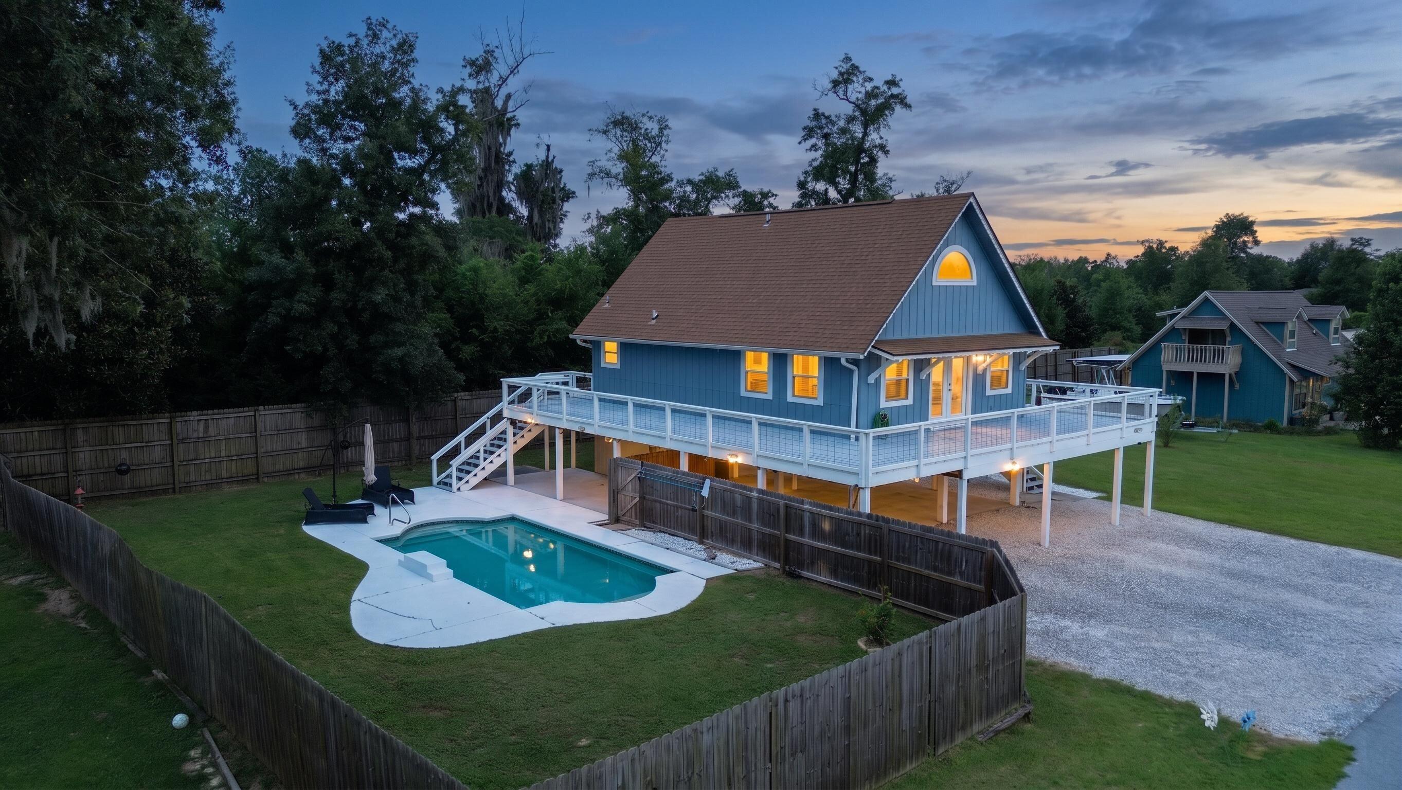 Welcome to your ultimate move-in ready retreat at 4026 Kirkpatrick Road! Situated just steps from deeded access to Deer Point Lake, this immaculate 2-bedroom, 2-bathroom home offers the ideal combination of freshwater recreation, major structural upgrades, and low-maintenance outdoor living with no HOA restrictions. The property features high-ticket recent improvements designed for total peace of mind, including brand new energy-efficient windows, a brand new central A/C system, and a 2019 roof. Step outside into your personal backyard oasis centered around a private, fully fenced inground gunite pool. It provides the perfect layout for relaxing after a day on the water, cooling off in the sun, or entertaining family and guests. For outdoor enthusiasts and travelers, the site offers abundant vehicle storage with expansive covered parking, featuring a dedicated high-clearance covered spot built to accommodate a boat or camper. Enjoy deeded access to Deer Point Lake just steps from your front door for effortless paddle-boarding and fishing on Panama City's premier freshwater lake. Located in a quiet, scenic setting with an easy commute into Lynn Haven, Panama City amenities, Tyndall Airforce Base, Panama City Beach, Hospitals, and local public boat launches. Whether you are looking for a turn-key primary home, a relaxed weekend sanctuary, or a strategic rental investment, 4026 Kirkpatrick Road provides exceptional freedom and lifestyle value. Schedule your private showing today