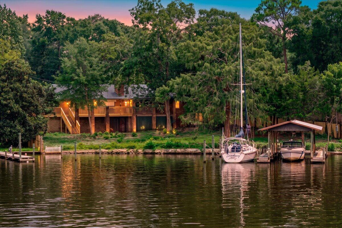 First time offered on the market on Swift Creek Bayou.  Deepwater access with boat house, lift and additional boat slip.  Boasting a 120' along the bayou.  The home is need of renovation - the best thing about it is the expansive basement with over 2000 sq ft for your own creativity.  New Roof July 2026, New Water heater 2025.  Oversized garage makes for a great workshop area.