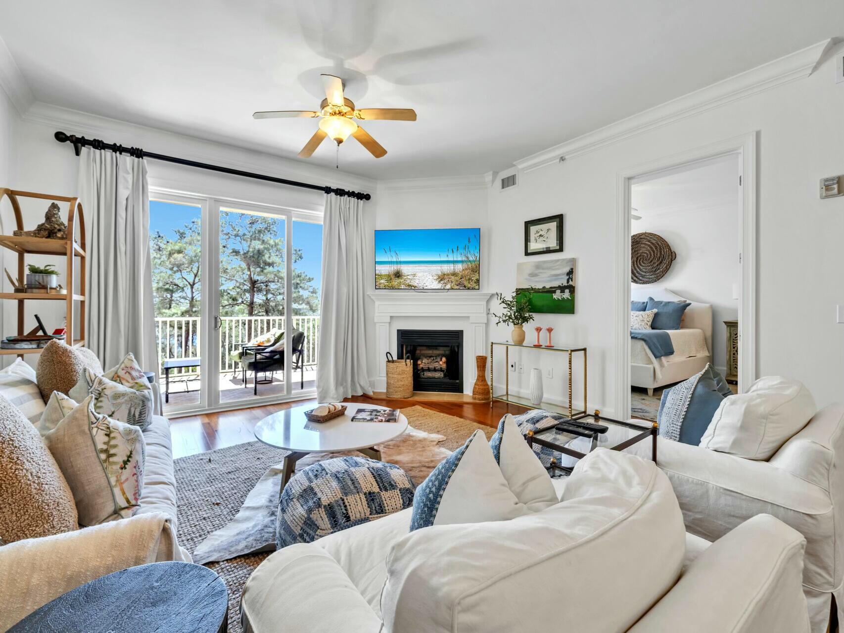 Priced to sell!!  Tucked away in the exclusive gated community of Sanctuary at Redfish, this stunning condo is a hidden gem.  Surrounded by nature and overlooking a rare coastal dune lake with glimpses of the Gulf, it's the perfect place to unwind. The freshly painted open-concept layout boasts a cozy gas fireplace and a spacious balcony--ideal for sipping your morning coffee or catching a breathtaking sunset.
 Resort-style amenities make every day feel like vacation, with multiple pools (one heated), hot tubs, a grilling area, garage parking, storage cages, a fire pit, lush terraces, and a fitness center. Plus, with private boat access, you can paddle out on Big Redfish Lake and explore one of the most serene coastal lakes in the world. Whether you're looking for