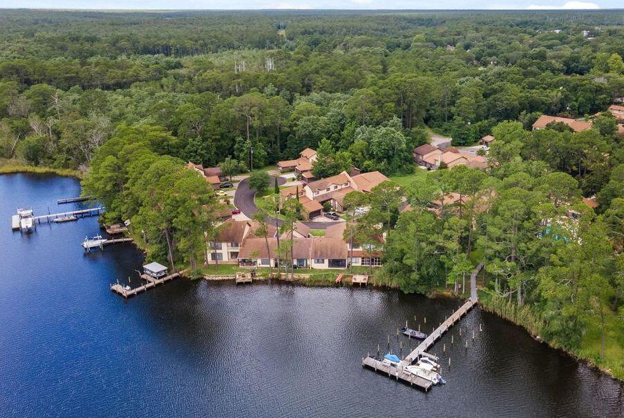 This waterfront complex is tucked away off of Tom's Bayou in Valparaiso! Enjoy boating, fishing, swimming in the community pool, etc. This very nice two story townhome has plenty of space. Open floor plan downstairs for living/dining & kitchen areas (NO carpet downstairs - all tile) along with a semi-private retreat to relax in off the back porch. All (brand new carpeted) bedrooms located on the second floor with the master having a large walk-in closet. Complex features a community pool. No Smoking inside and no pets . All Coastal Realty Services residents are enrolled in the Resident Benefits Package (RBP) which includes renters insurance, HVAC air filter delivery (for applicable properties) and our best-in-class resident rewards program, and much more! More details upon application.