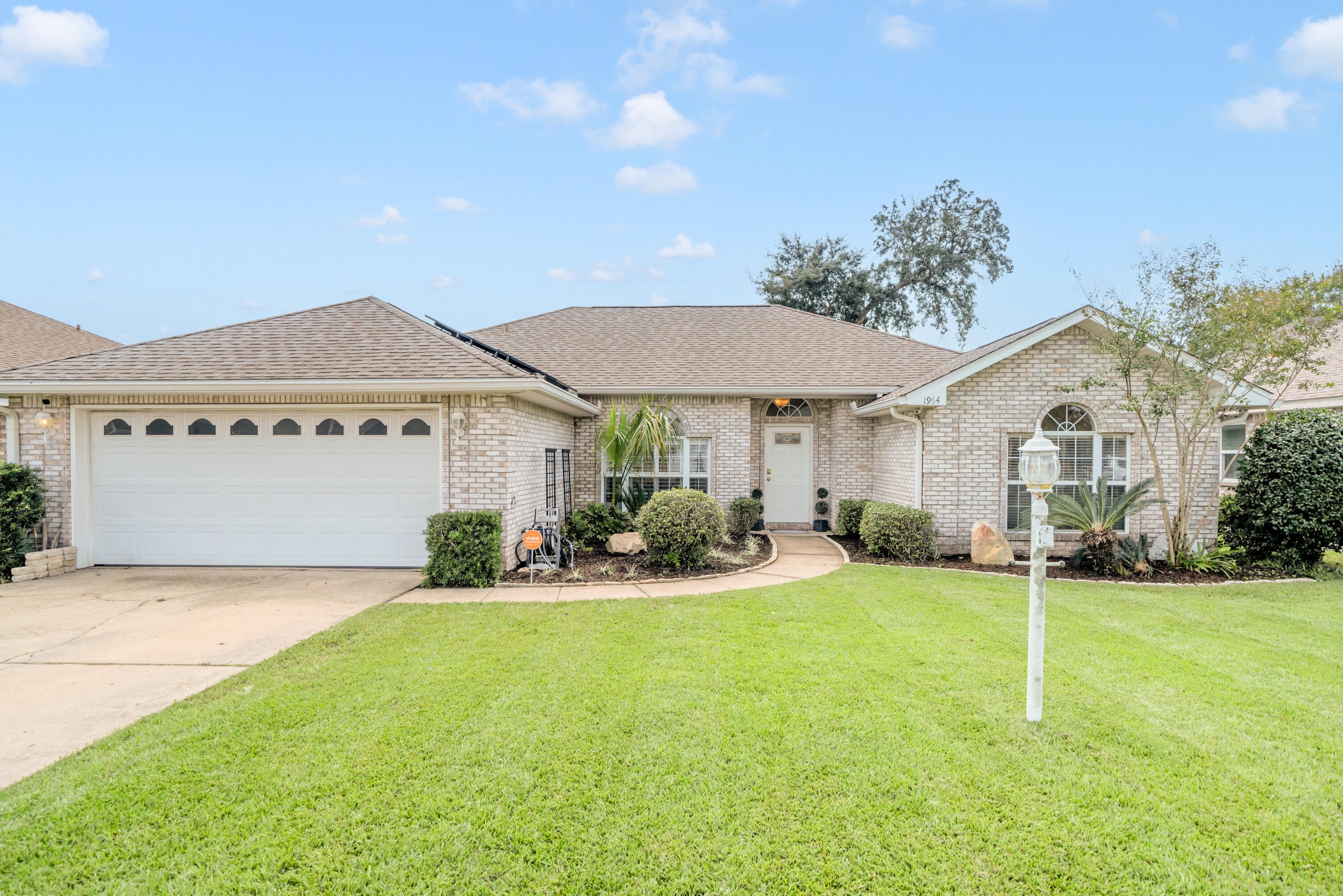 *2.25% Assumable VA Loan* Don't miss your opportunity to be the next proud owner of this beautiful home that's nestled within a cul-de-sac in one of the most desirable communities in Fort Walton Beach - Northridge Creek! Ideally located within very close proximity to both Eglin AFB and Hurlburt Field, this home blends charm, functionality, and convenience in one truly special property! Inside this 3BR/2BA/1,847SqFt/2-Car Garage home is a welcoming entry that flows effortlessly into the dining space that's been enhanced with plantation shutters on the large front windows and it opens into a very large living room with a tray ceiling that elevates the entire main living area. A gas fireplace is located in the corner of the living room with a white wooden mantle that anchors the space and creates a warm, inviting focal point. This home features a thoughtfully designed open & split floorplan that's perfect for entertaining. It's been beautifully upgraded with plank tiled floors in all main areas and all rooms have been recently painted with ''Accessible Beige'' by Sherwin-Williams. All 3 bedrooms are carpeted and each contain walk-in closets providing ample storage. The kitchen boasts stainless steel kitchen appliances, corian countertops, recessed lighting, pantry cabinets, a breakfast bar for casual dining, and a spacious breakfast nook area. The expansive primary suite is enhanced with a tray ceiling and provides plenty of room to have a reading nook/office space. The tilled primary bathroom offers 2 separate cultured marble vanities, a large cultured marble walk-in shower, a separate cultured marble jetted soaking tub, and a large walk-in closet. 
Outside, there are underground utilities and a well pumped irrigation system that irrigates the front and back yards.Enjoy entertaining your family, friends, and/or your fur babies within the privacy fenced backyard space that requires very minimal lawn maintenance.
You'll have peace of mind knowing the major system items have been updated: 2019 shingle roof, 2026 water heater, and a 2015 HVAC unit with a Pristine Air UV System. 
This home is move in ready, thoughtfully upgraded, offers the ideal balance of location, function, style, low maintenance, and provides easy access to bases, beaches, and everyday conveniences. Don't wait! Let's schedule your private tour today! 
~ Affordable Home Insurance quote is for $1,745.55/Yr.
~ HOA fee is only $150 per year.
~ Solar panels will be paid off by Sellers at closing.

*** 1964 Chesapeak Ridge is only....
* 1 mile to the HCA Florida Fort Walton Destin Hospital (Fort Walton Beach Medical Center)
* 6.8 miles to the Destin-Fort Walton Beach Airport 
* 5.9 miles to the main (front) gate to Eglin AFB
* 4.5 miles to the back gate of Hurlburt Field AFB
* 21 miles to Army 7th Group Special Forces compound
* 11 miles to US Coast Guard Station Destin
* 19 miles to Naval School Explosive Ordnance Disposal 
* 18 miles to Duke Field AFB
* 0.6 miles to Liza Jackson Preparatory School
* 6.4 miles to Longwood Elementary School
* 1.9 miles to Pryor Middle School
* 2.1 miles to Choctawhatchee High School
* 2.2 miles to Northwest Florida State College
* 7.2 miles to the beach at the Boardwalk on Okaloosa Island
* 3.8 miles to Publix
* 2 miles to Walmart
* 1.7 to Mooney Park Pickleball Courts