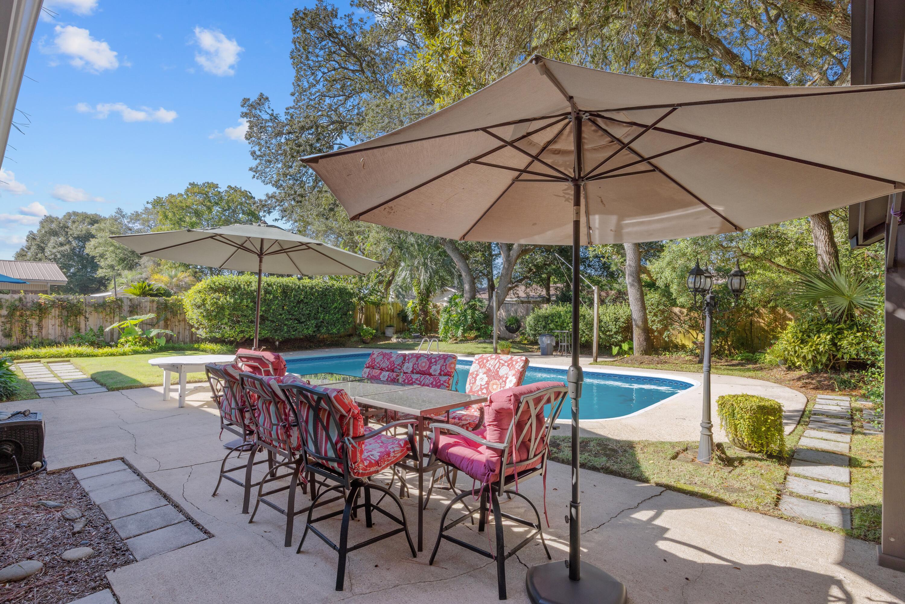 Stylish, Move-In Ready Home with Pool & Prime Fort Walton Beach Location!
Discover the perfect blend of comfort, style, and functionality in this beautifully maintained Fort Walton Beach home. One of its greatest features is it has it's own well so you never have to pay water for pool or sprinkler system! A new roof (2023) and water heater (2020), this move-in ready property is packed with updates that make life easy and enjoyable. The split-bedroom floorplan boasts tile floors throughout, a spacious living room with built-in surround sound, and a separate family room both opening through sliding glass doors to your patio and sparkling in-ground pool, perfect for entertaining or relaxing. The galley-style kitchen shines with a breakfast bar, tile backsplash, crown molding, recessed lighting, and a skylight that floods the space with natural light. The updated secondary bathroom features a sleek tiled shower with glass doors, while the primary suite offers his-and-hers closets, a double vanity, separate shower and jacuzzi tub, and built-in storage for ultimate organization. Additional perks include a two-car garage with backyard access, convenient laundry closet, and mature landscaping front and back. Tucked on a quiet end-corner lot, enjoy added privacy and minimal traffic. Centrally located in Fort Walton Beach, you're just minutes from shopping, dining, and entertainment, this home truly offers the ideal mix of updates, comfort, and location.