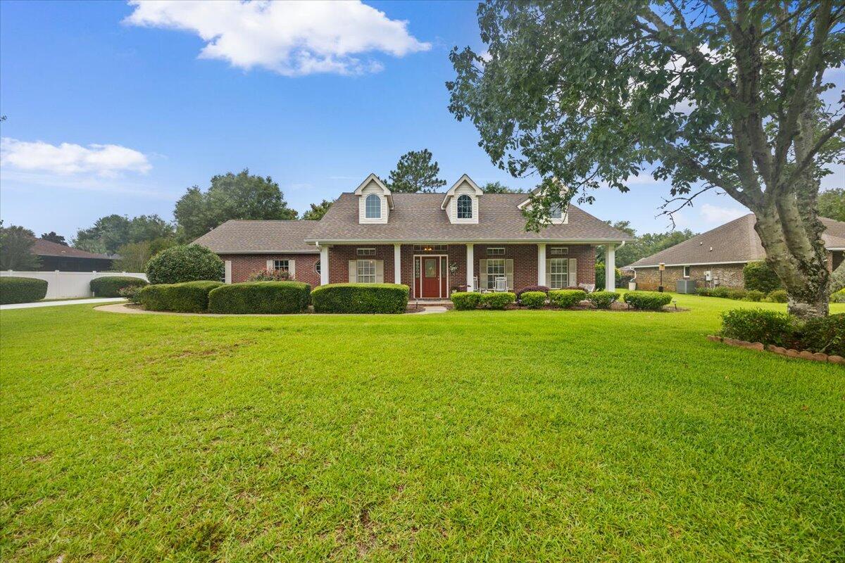 PRICE IMPROVEMENT!! Welcome to 2555 Holley Place - an impeccably maintained home tucked inside the sought-after Holley by the Sea community in Navarre. From the moment you arrive, the beautifully landscaped yard and inviting curb appeal set the tone for what's inside. Step through the front door and you'll notice updated flooring (2024) and refined finishes that add warmth and character throughout. The spacious layout features thoughtful details like built-in shelving surrounding a functional propane gas fireplace. The kitchen blends functionality with charm, offering features such as glass-front cabinetry, updated range (2025), and counterspace for days--perfect for everyday living or entertaining. 

Just off the kitchen, the family room centers around a cozy fireplace and opens seamlessly to the backyard through stunning French doors.

Outdoors is where this home truly shines. The expansive ~500 sq ft screened back porch creates the perfect nature retreat to gather around and watch and listen to wildlife in the expansive backyard.  Whether you're enjoying quiet mornings or hosting friends, this space invites you to slow down and enjoy the Florida lifestyle. 

Living in Holley by the Sea means access to one of the area's most impressive recreation centers, offering pools, fitness facilities, Pickleball and tennis courts, and more--just minutes from your doorstep. You're also conveniently located near local military installations (NAS Pensacola, Whiting Field, Hurlburt Field, and Eglin AFB) making commuting simple, while the sugar-white sands and emerald waters of Navarre Beach are just a short drive away.

If you've been looking for a well-cared-for home with welcoming charm, thoughtful upgrades, and a location that connects you to both everyday conveniences and the best of the Emerald Coast, this one is worth a closer look.