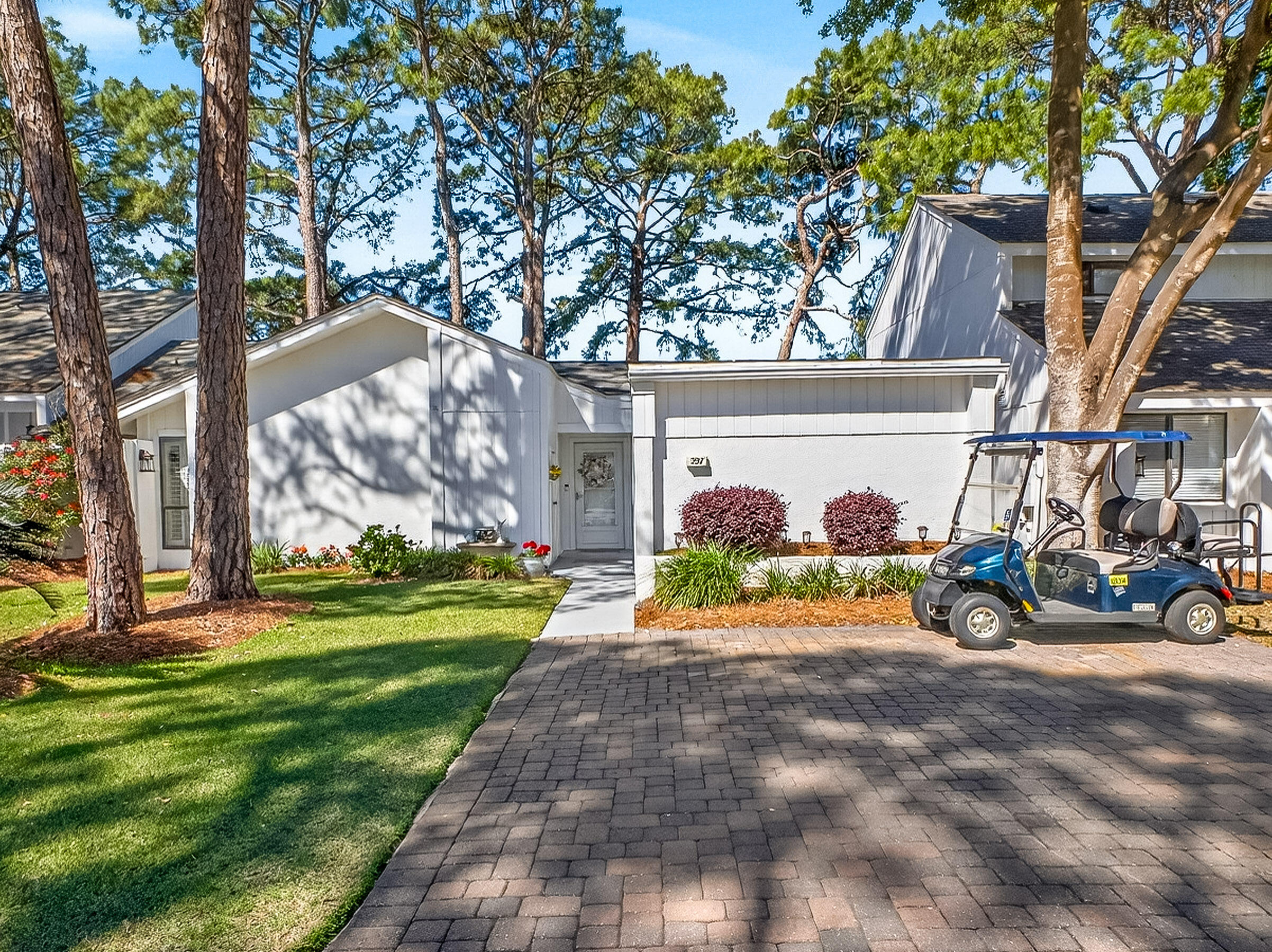 Tucked within Linkside Village in Sandestin Golf and Beach Resort, this charming single-level Florida cottage offers an effortless blend of comfort, style, and convenience. Featuring 2 bedrooms, 2 baths, and a versatile flex/sunroom, the home spans approximately 1,401 square feet of thoughtfully designed living space. The updated kitchen showcases new countertops and appliances, complemented by an eat-in dining area and breakfast bar--perfect for both everyday living and entertaining. Natural light fills the home through a central skylight, while plantation shutters add timeless coastal elegance. Durable tile and laminate flooring run throughout, enhancing both style and functionality. The spacious primary suite features an updated bath already plumbed for a double vanity, offering both comfort and future potential. Generous storage is found throughout, including a custom built-in, a large pantry, and an outdoor storage closet. Step outside to the screened-in porch overlooking the first hole of the Links Golf Course--an ideal setting for quiet mornings or relaxing evenings. Additional highlights include fresh exterior paint completed in 2025 with a transferable 10-year warranty, hot water heater was updated in 2022 and HVAC in 2026, as well as a 4-seater golf cart with a brand-new battery (2026), making it easy to enjoy the nearby SOA pool and all that Sandestin has to offer. Whether you're searching for a primary residence, vacation retreat, or investment opportunity, this delightful cottage captures the essence of relaxed, resort-style living in one of Sandestin's most charming communities.

As an introduction to the Sandestin lifestyle, we invite our new owners to explore amenities that make Sandestin special. The listing brokerage and seller(s) are presenting the buyer(s) of this property with (2) 90-minute rounds of Tennis court time, a golf foursome at one of our three championship courses, and a round of golf for up to four (4) players at the unrivaled Burnt Pine Golf Club.

Sandestin Golf and Beach Resort features more than seven miles of beaches and pristine bay front, four championship golf courses, 15 world-class tennis courts, a 226-slip marina, a fitness center, spa and celebrity chef dining. Shop, dine and play at the charming pedestrian village, The Village of Baytowne Wharf and more. Inside the gates of the resort, residents enjoy a balanced lifestyle of high-class living, spanning the 2,400 acres from the beach to the bay. Everything within the gates of the resort is accessible by golf cart or bicycle. The entire resort is interconnected by miles of pedestrian, bike and golf cart paths that weave through groves of live oaks, meandering past natural lagoons, fountains, man-made lakes, and meticulously landscaped fairways.