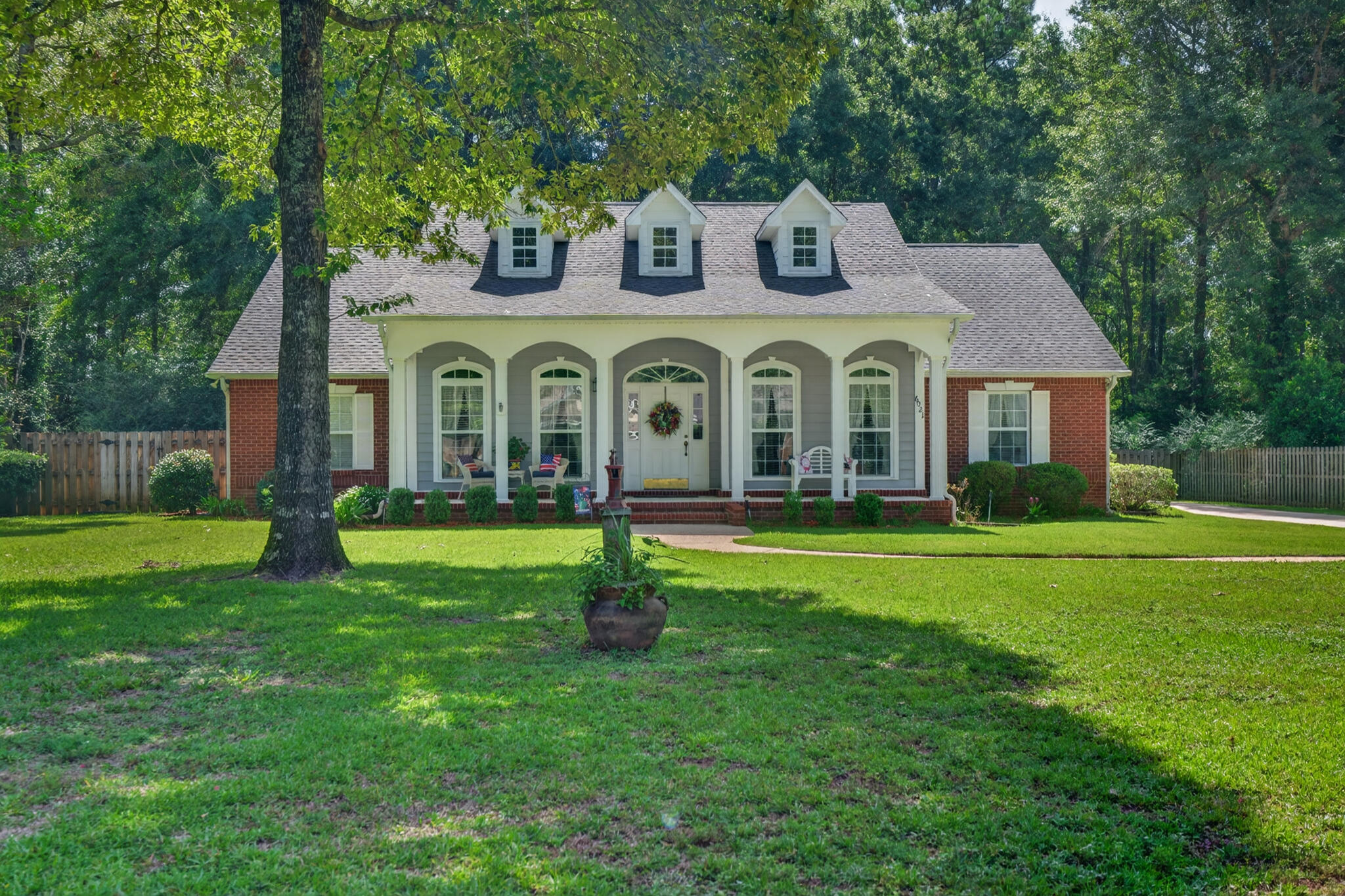 This Crestview home truly has it all! Situated on a spacious half acre lot, this beautifully maintained 3 bedroom, 2 bathroom home is packed with features today's buyers are looking for.

From the moment you walk in, you'll be welcomed by soaring cathedral ceilings that create an open, airy feel. The inviting living room is centered around a beautiful fireplace, making it the perfect place to gather with family and friends. The stunning culinary kitchen offers both style and functionality with ample workspace and storage, making meal preparation and entertaining a breeze.

The spacious primary suite and well appointed secondary bedrooms provide comfortable living, while the washer and dryer are included, making this home even more move in ready.

Step outside to your own private oasis featuring a screened in pool, a beautifully landscaped front yard, and a fully fenced backyard that's perfect for entertaining, pets, or simply relaxing. A storage shed provides the ideal space for lawn equipment, tools, or seasonal items, and the spacious 2 car garage offers even more storage and convenience.

The best part? This home has been exceptionally cared for. The seller has stayed on top of maintenance throughout ownership, giving buyers peace of mind and a home that's truly move in ready. If you've been searching for a property that combines space, comfort, thoughtful upgrades, and outstanding upkeep, this Crestview gem is one you won't want to miss.