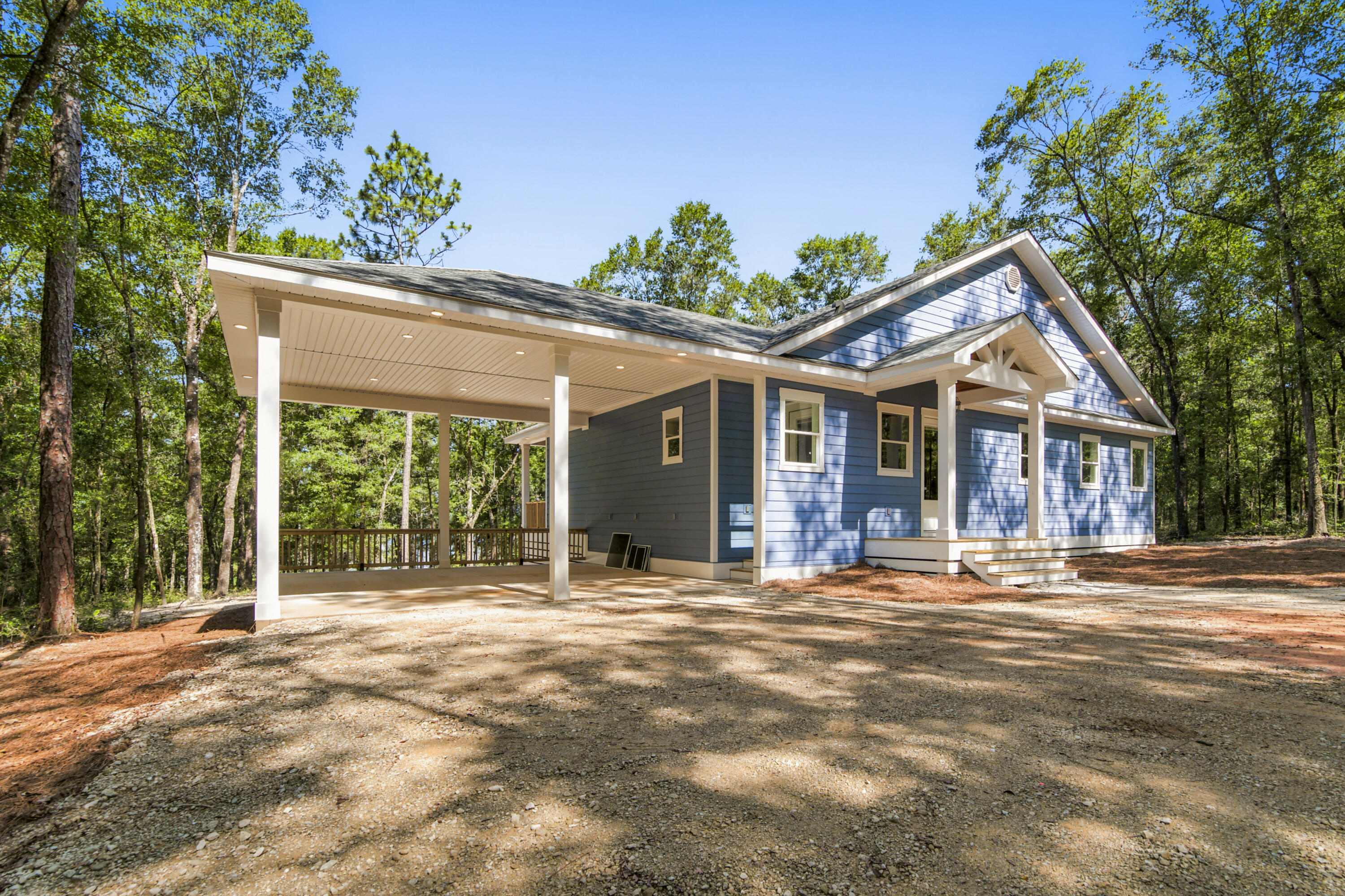 Welcome to your brand-new waterfront home on Holly Lake. This thoughtfully designed home offers a private dock, peaceful wooded surroundings, and direct lake access for fishing, kayaking, or simply enjoying the view. Inside, you'll find an open floor plan with 10-foot ceilings, cathedral ceilings, custom cabinetry, tiled showers, and tongue-and-groove porch ceilings. Additional upgrades include a hot water recirculation system for added comfort and convenience. Whether you're looking for a full-time residence or a weekend retreat, this move-in-ready home offers the perfect blend of quality craftsmanship and waterfront living, just minutes from DeFuniak Springs.