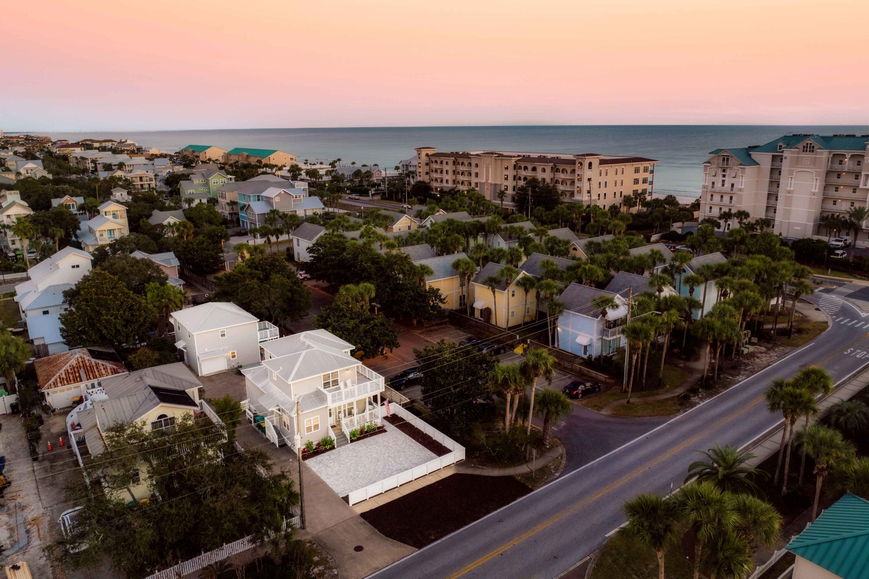 Experience the ultimate coastal investment or luxury multi-family retreat at 73 Crystal Beach Drive, offering two fully renovated, fully furnished homes on a single prime lot just a half-block from the beach. Built for premier hospitality, the resort-style outdoor oasis features a private in-ground pool, sun deck, custom putting green, garage, and parking for up to eight vehicles to comfortably accommodate up to 16 guests.

The three-bedroom, three-bathroom main residence welcomes you with a bright, open-concept layout centered around a gourmet kitchen with high-end Viking appliances, a convenient main-level guest bedroom, a full bathroom, and a dedicated laundry room. Upstairs, find two additional bedrooms--including the primary suite--both featuring private en suite baths and direct access to an expansive wraparound balcony designed to catch coastal breezes.

Steps across the outdoor living area, the detached carriage house serves as a completely independent haven. It boasts three bedrooms plus a dedicated bunk room, two full bathrooms, a fully equipped kitchen, and dining seating for six.

Whether you are targeting peak short-term rental performance or seeking a private multi-generational sanctuary by the sea, this turnkey compound delivers an unmatched combination of location, scale, and resort-style amenities.