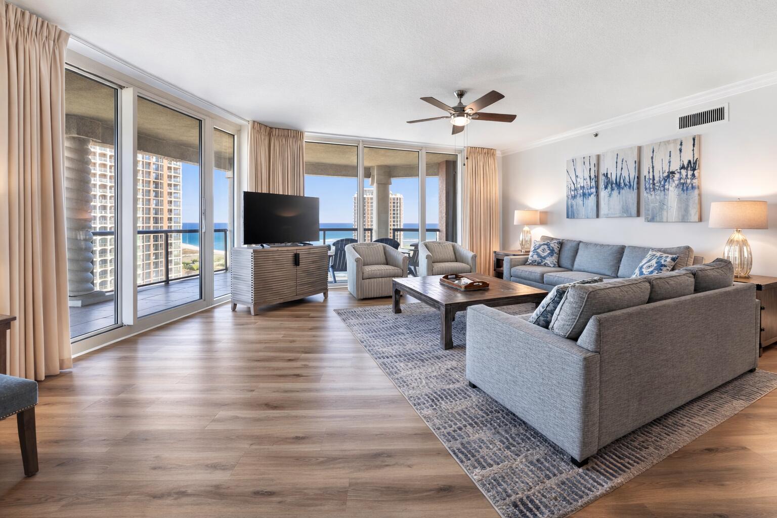 Welcome to this stunning, upgraded twelfth floor residence in Tower 5 showcases breathtaking 180-degree views of the Gulf and Santa Rosa Sound! The unit is being sold FULLY FURNISHED, offering a seamless move-in or rental ready opportunity. With rental history coming in at over $100k, this property offers prime short term rental potential. This unit offers an updated HVAC (2023) and water heater (2020). Enjoy the expansive balcony (44x17ft) designed for entertaining or taking in the sparkling water views and sunsets. Inside, the open-concept areas are anchored by Gulf views and enhanced by high ceilings and crown molding. Luxury vinyl plank flooring runs throughout the entire unit, complemented by fresh, neutral paint. The kitchen is beautifully appointed with quartz countertops, white cabinetry, sleek backsplash, a breakfast bar, and an adjacent dining area. Each bedroom is privately positioned on its own corner of the unit and each features its own en suite bathroom. The primary suite offers direct balcony access, a spacious walk-in closet, and a beautifully upgraded tiled walk-in shower, double vanities, and a water closet. A second bedroom also enjoys balcony access, a walk-in closet, and an en suite bath with a tiled standing shower. The third bedroom is generously sized to accommodate two beds, includes two closets, and features a bathroom with a tub/shower combo. A half bath sits just off the main living area for guest use. Additional highlights include two assigned co vered parking spaces, an assigned storage unit, and a built in grilling area on the balcony. Portofino Island Resort offers unparalleled amenities including direct access to both the Gulf of Mexico and the Santa Rosa Sound, multiple pools and spas, a full-service spa, a state-of-the-art fitness center, tennis courts, and on-site dining. Only minutes from the dog park and all that Pensacola Beach has to offer, this condo will make you feel at home and on vacation all year long!