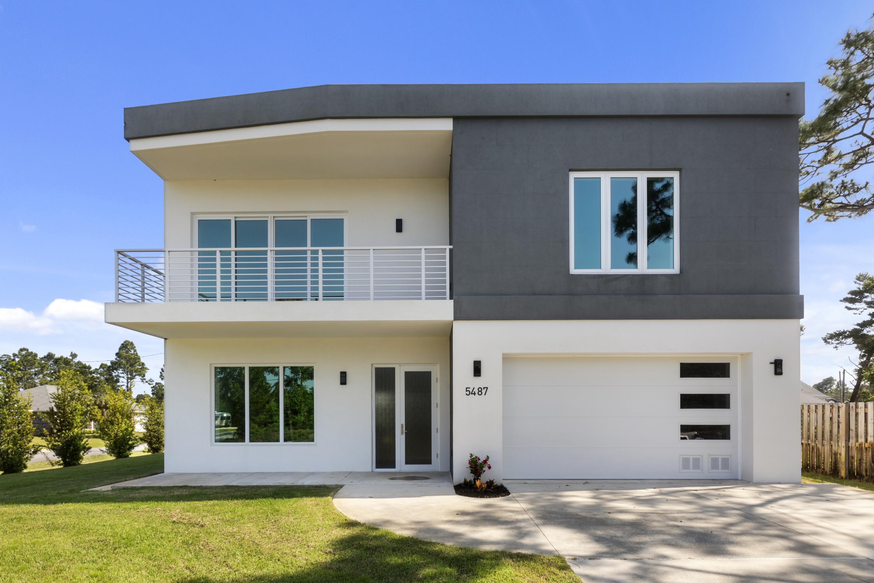 Welcome to 5487 Cimmeron Ct in Gulf Breeze, with 4 bedrooms and 3 and 1/2 bathrooms, where modern design meets one of the most durable and thoughtfully built homes in the area. This beautiful home features over 10ft ceilings and large oversized rooms with plenty of closet/storage and space for your family. Tucked away on a quiet cul-de-sac, this brand-new, never-lived-in home offers a rare opportunity to enjoy the Gulf Coast lifestyle with peace of mind and long-term value.

Built with Insulated Concrete Form (ICF) construction and impact-resistant windows and doors, this home is designed for strength, energy efficiency, and year-round comfort - making it one of the most resilient and secure homes available in Gulf Breeze.