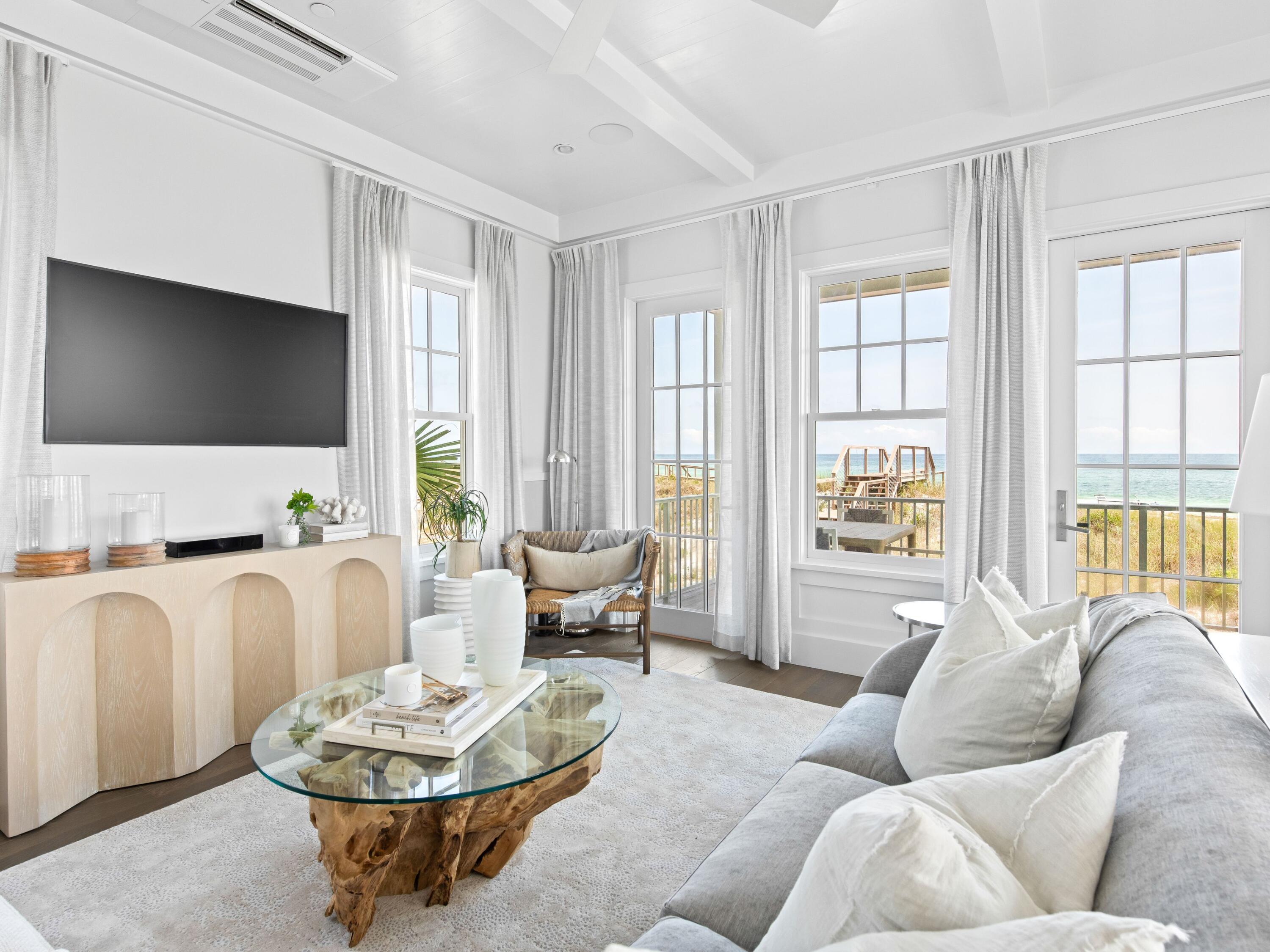 Now complete and move-in ready, 40 Lupin Beach Drive is an architecturally refined Gulf-front home set within one of Inlet Beach's most exclusive beachfront communities. Encompassing 3,038 square feet across four thoughtfully designed levels, this four-bedroom, four-and-a-half-bath residence blends timeless design, curated finishes, and unobstructed views of the Gulf of Mexico.

The home's exterior palette—soft whites, champagnes, and muted grays—sets a serene coastal tone, while the interiors feature wide-plank wood flooring, natural quartzite countertops, and classic shaker cabinetry.