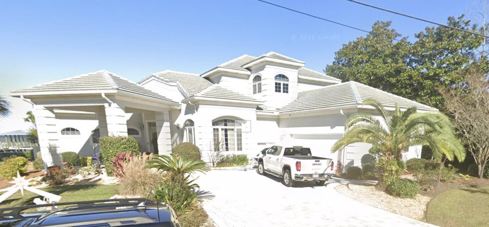 Welcome to your ultimate coastal sanctuary on the bay! Situated on a rare, sprawling 0.46-acre lot in Santa Rosa Beach, 332 Casa Grande Lane offers an incredible waterfront lifestyle packed with luxury, privacy, and endless space for outdoor enjoyment. Step into your private backyard oasis featuring an inviting pool, **brand-new pavers added in 2025**, an expansive yard, and a custom dock built to last for endless days of boating, fishing, and taking in breathtaking bay sunsets. The unique two-story design offers exceptional layout flexibility: the main floor features a spacious primary master suite, a chef's kitchen equipped with a premium Sub-Zero refrigerator, and a separate formal dining room perfect for entertaining. Head outside and take the charming exterior spiral staircase up to the second floor, which houses two additional private bedrooms--ideal for guests, family, or a high-end coastal office setup. Complete with major modern updates including a brand-new roof (2026) and a whole-home Culligan water softener system, this turnkey bayfront haven blends peace of mind with unrivaled Gulf Coast living.