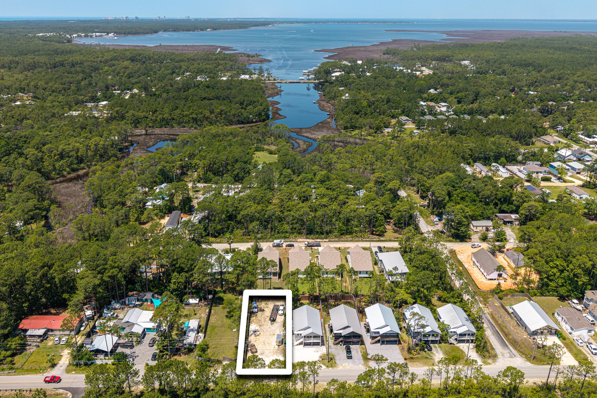 Build your primary residence or investment property in the heart of Santa Rosa Beach! NO HOA!! 5 minutes from picturesque Hogtown Bayou public boat launch for access to Choctawhatchee Bay. Just a 10 minute drive to the beaches of the Emerald Coast, with newly added public parking and tram service to public beach accesses across wildly popular 30A from the West End to Grayton Beach! Take your street legal golf cart from this lot all the way down South County Road 393 to 30A to enjoy the finest shopping and dining, all the way to Grayton Beach, Seaside, Alys Beach and Rosemary Beach! NEW SPORTS COMPLEX COMING TO CHAT HOLLY AREA - 220 Acre recreational complex including a ball fields with hiking trails winding through beautiful lakes, all situated just off Chat Holly Rd, with plans for stormwater control, wetlands protection, and 2 new connector roads from HWY 98 to Chat Holly Rd! Home next door is also for sale, MLS ID 1003706 - purchase both the home and the vacant lot and create your private large estate! Central location is close to schools, restaurants, grocery stores, hospital. Call today for more info!