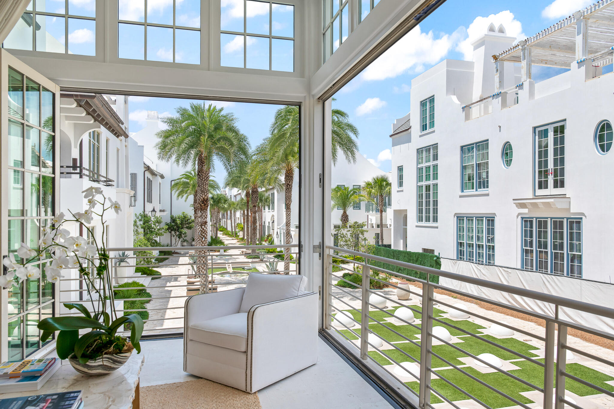 Positioned overlooking Turtle Bale Park in Alys Beach, this south of 30A custom home by Khoury Vogt Architects is designed to embrace its surroundings while offering many magic moments throughout the house. Corner bi-folding doors bring in natural light and open the main living area to the beauty of the park below and views down the iconic Turtle Bale Pedestrian Path toward the gulf. 

24 Kings Castle Court features 4 bedrooms, 4 full baths, & 2 half baths, including a
primary suite thoughtfully separated from the 3 guest bedrooms for added privacy. A main level sunroom seamlessly opens to a private courtyard pool, perfect for those summer days. Just moments from gulf access at Turtle Bale Green, the location offers easy access to the beach while remaining tucked within one of Alys Beach's most desirable settings. Above, a fourth-floor rooftop terrace showcases gulf views and provides an elevated space for relaxing & entertaining.