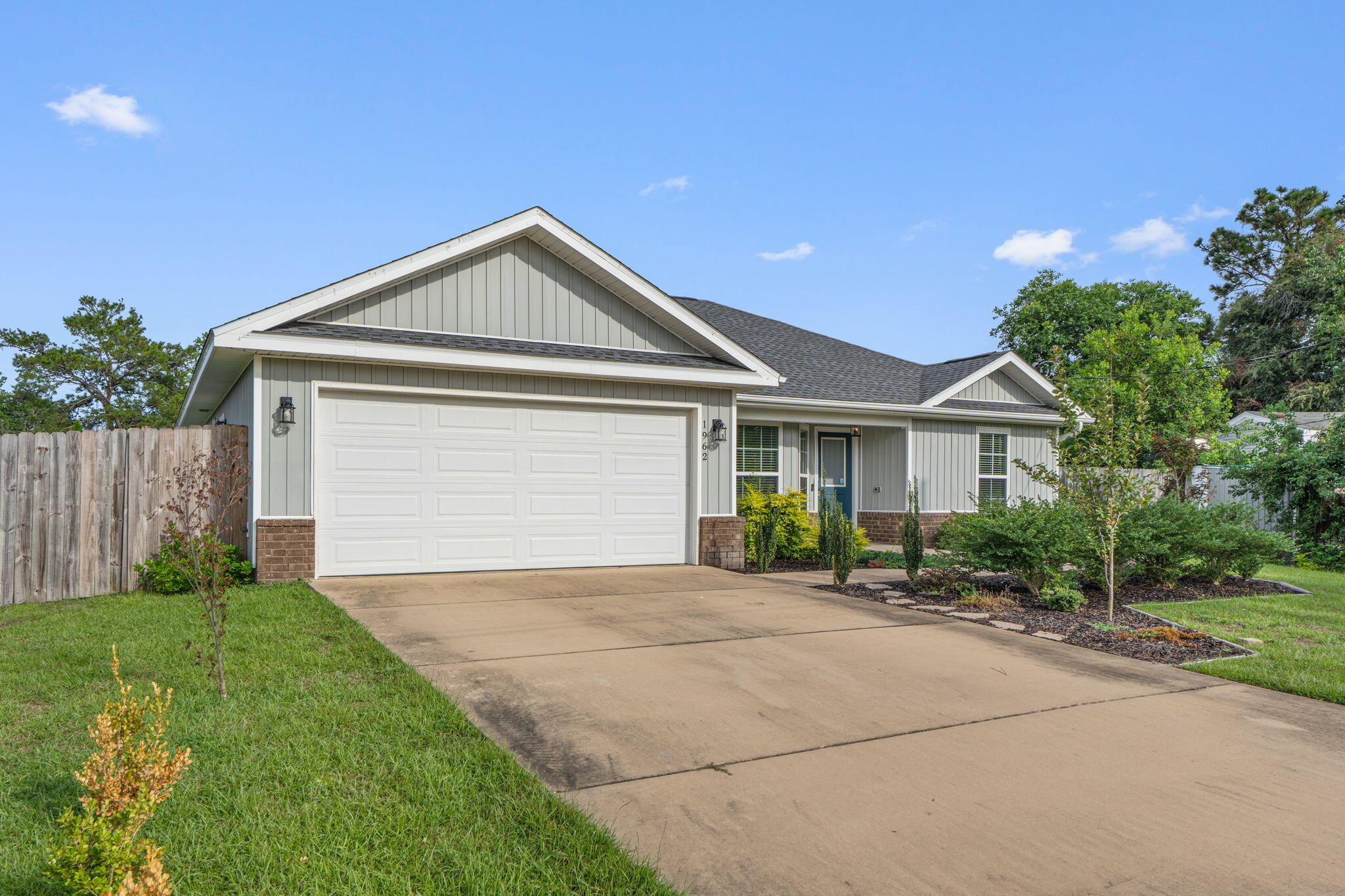 Welcome home to this beautifully maintained 3-bedroom, 2-bath home built in 2020 and filled with thoughtful indoor and outdoor features! Fresh paint throughout gives the home a bright, move-in-ready feel. The open-concept kitchen and living area features a vaulted ceiling that adds to the spacious, airy feel of the home. The kitchen stands out with butcher block countertops, a tiled backsplash, huge center island, abundant cabinetry, and open shelving. A welcoming foyer offers a convenient storage closet, while the spacious primary suite features a walk-in closet and private bath with a double vanity and tiled walk-in shower. With a 2020 build date, buyers can also appreciate the peace of mind that comes with a newer roof and major systems. Outside is where this property really shines! Lush landscaping and farm-style fencing create charming curb appeal, while the backyard is packed with spaces to relax, entertain, and enjoy. Fruit trees include peach, orange, pear, apple, fig, and crabapple, and extended pavers flow from the covered porch to create additional outdoor living space. A 16' x 12' cedar gazebo with a steel roof and paver flooring provides another great spot for entertaining, while a gravel fire pit area is ready for cool autumn evenings. There's also a storage shed for lawn equipment, tools, and more. For added convenience, a walking path provides access to the new Soundside High School. With newer construction, a standout open-concept kitchen and living space, incredible outdoor areas, and a backyard full of fruit trees, this home has so much to offer. Don't miss this one!