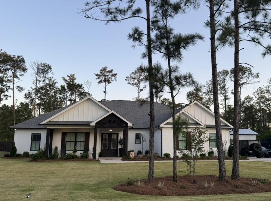 Beautiful home with spacious shop on a large corner lot with NO HOA! Looking for a peaceful place to live that is also close to the beaches and interstate? At just under 2500 sf this stunning custom home offers an open floorplan perfect for entertaining or you can step out back to relax in the privacy of the pool deck. It genuinely feels like a tropical escape!
The split floorplan consists of 4 bedrooms and 2 1/2 baths. Stainless steel appliances, LVP flooring, quartz countertops and plantation shutters throughout are a few of the upgrades. The bonus is the hidden storage in the master closet! 
The shop is 25 x 60 which consists of 625 sf living space and 875 sf open that could be used for a workshop or storage. 
You must see this one for yourself to truly understand how awesome it is!